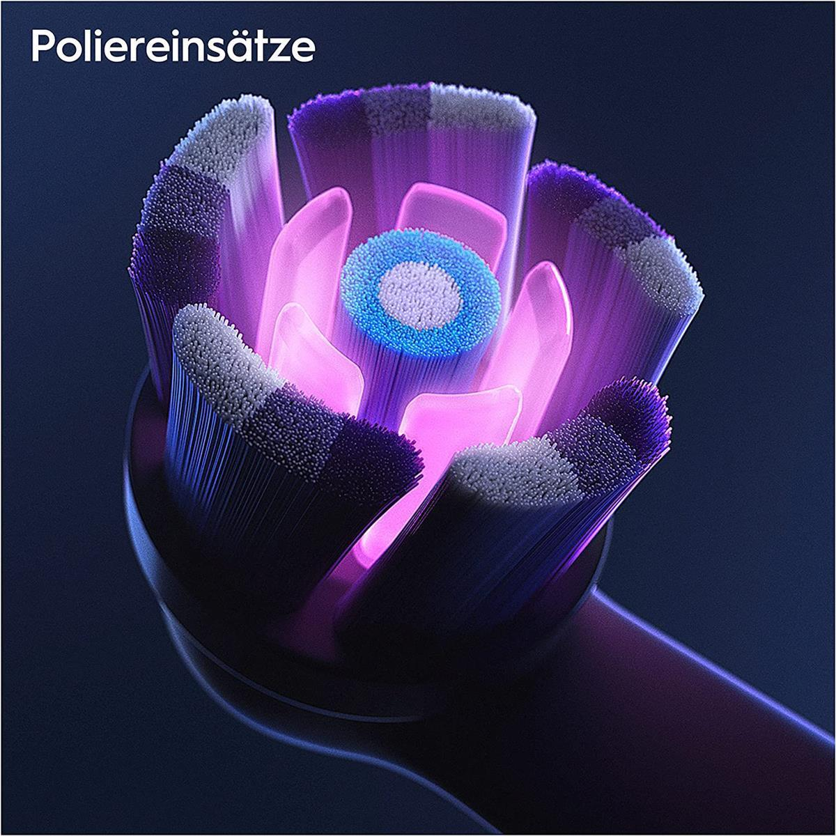 Nahaufnahme eines Zahnbürstenkopfes mit lila und blauen Borsten, von innen beleuchtet.