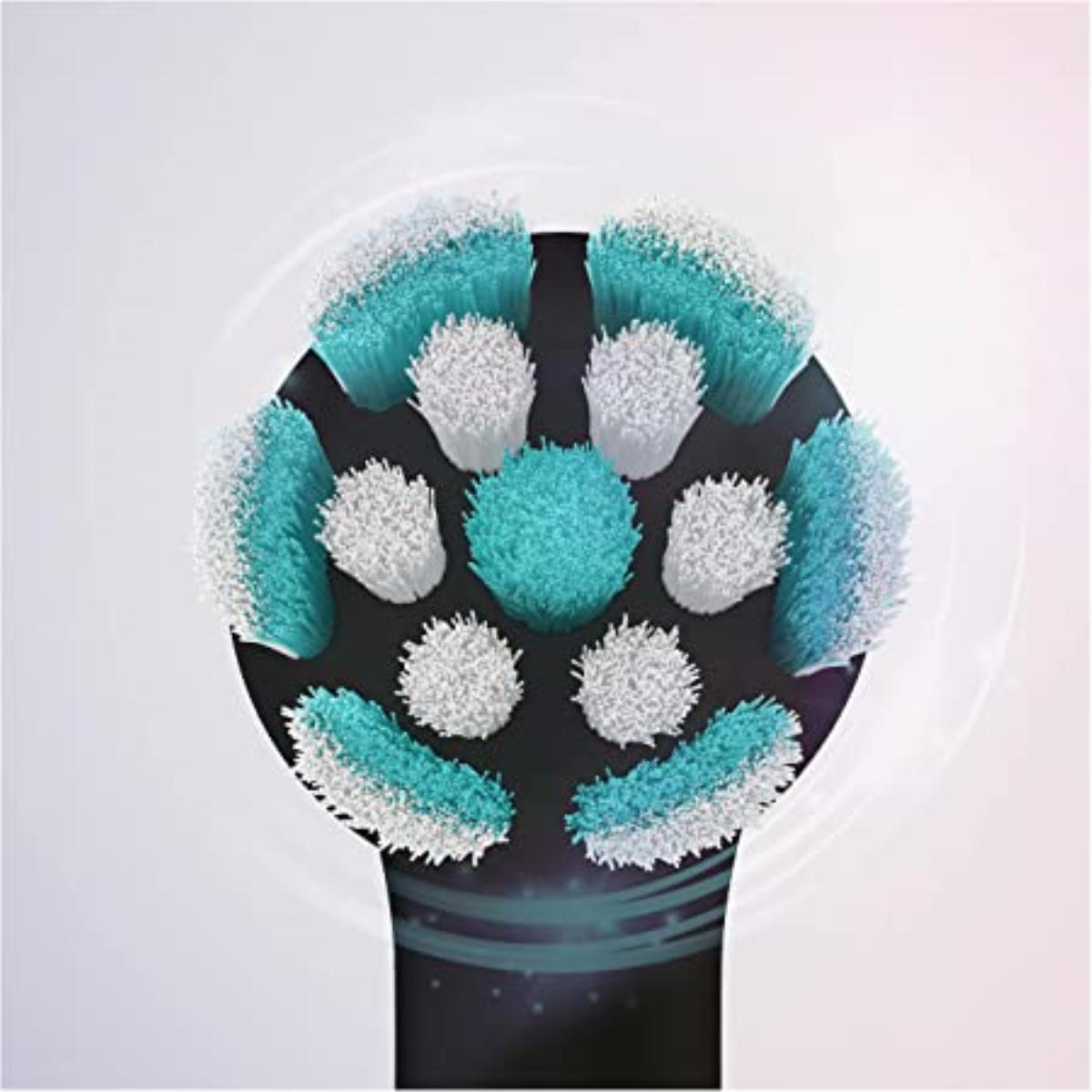 Zbliżenie na główkę szczoteczki elektrycznej z wieloma białymi i turkusowymi włosiami.