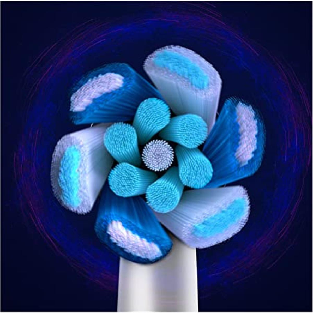 Primer plano del cabezal de un cepillo de dientes con cerdas azules y blancas dispuestas en círculo.