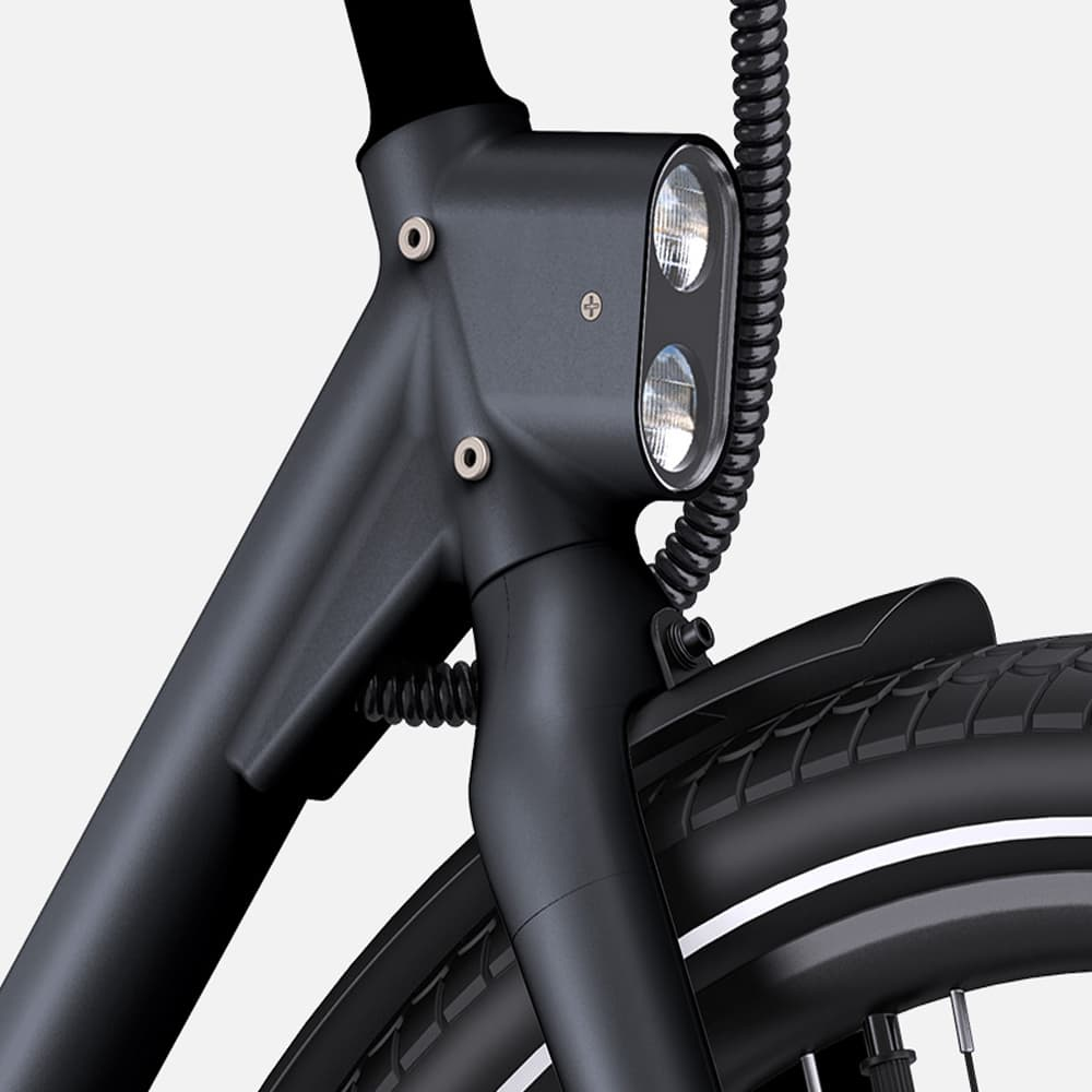 Faro de bicicleta negro. Dos luces, cuadro negro y cable en espiral.