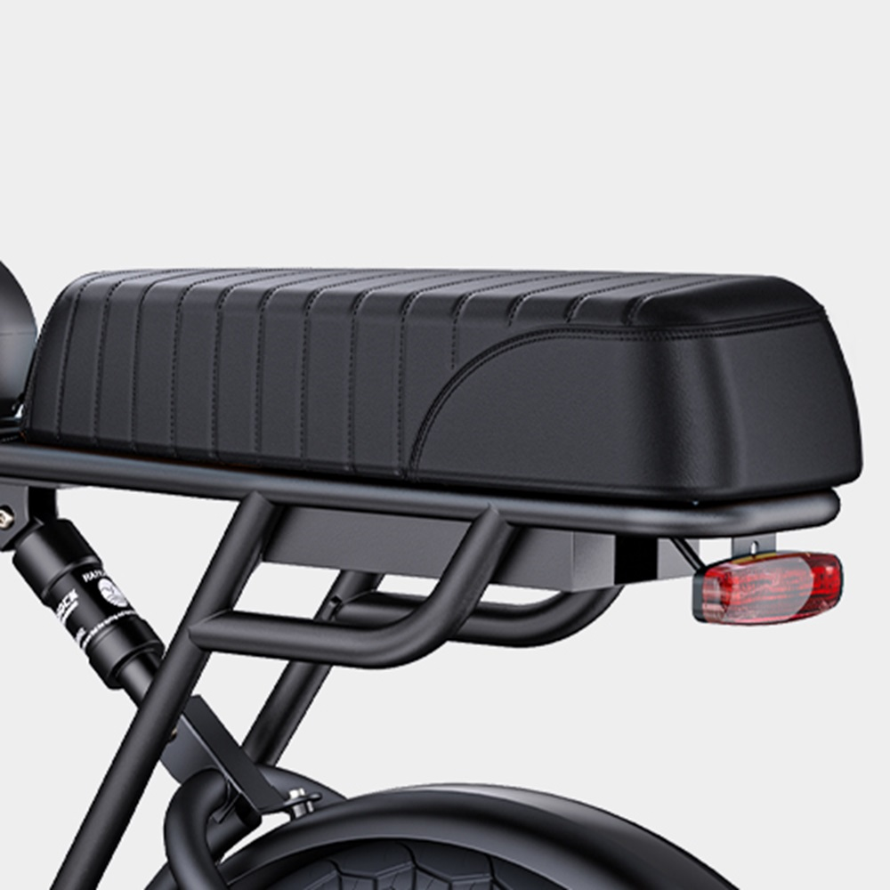 Asiento y cuadro de bicicleta negros con luz trasera roja, sobre fondo gris claro.