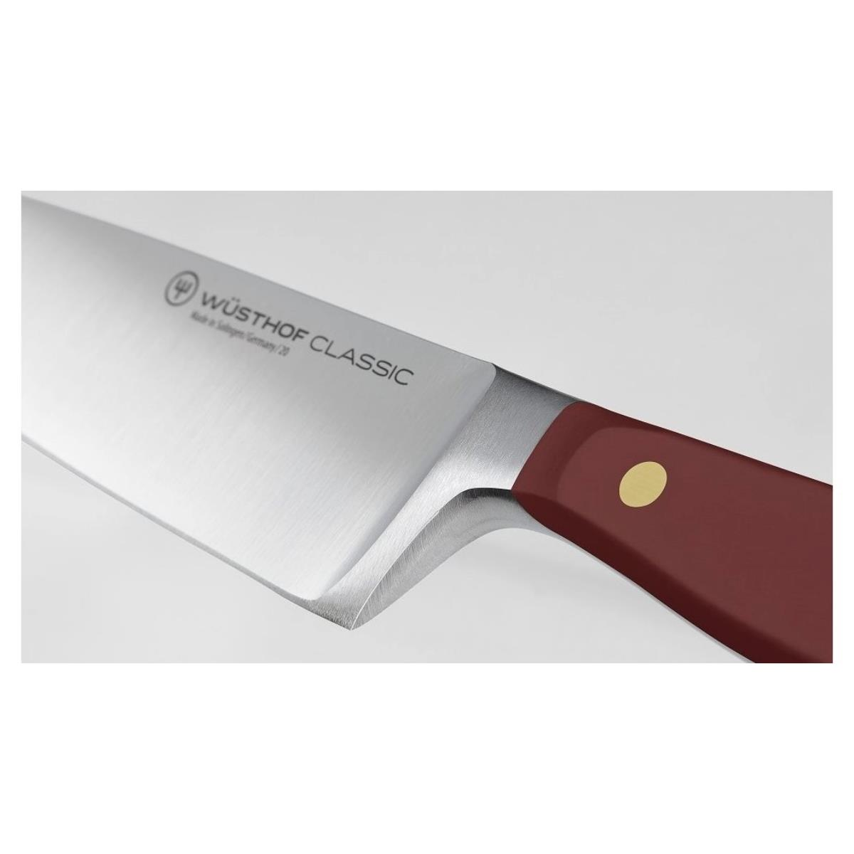 Wüsthof Classic Messer mit rotem Griff und goldenem Punkt.