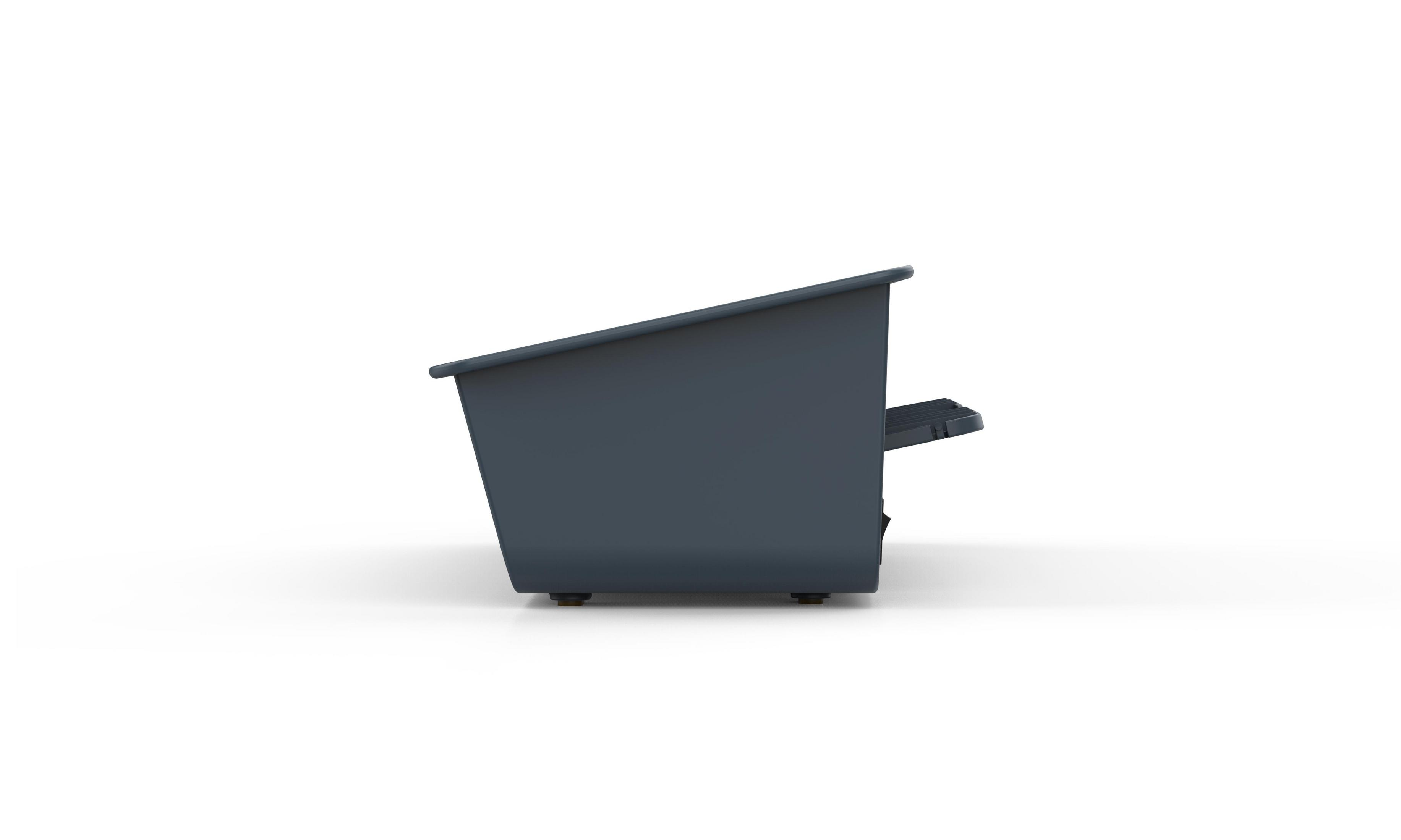 Widok z boku ciemnoszarego, kątowego, prostokątnego pudełka z małą platformą i stopkami na białej powierzchni.
