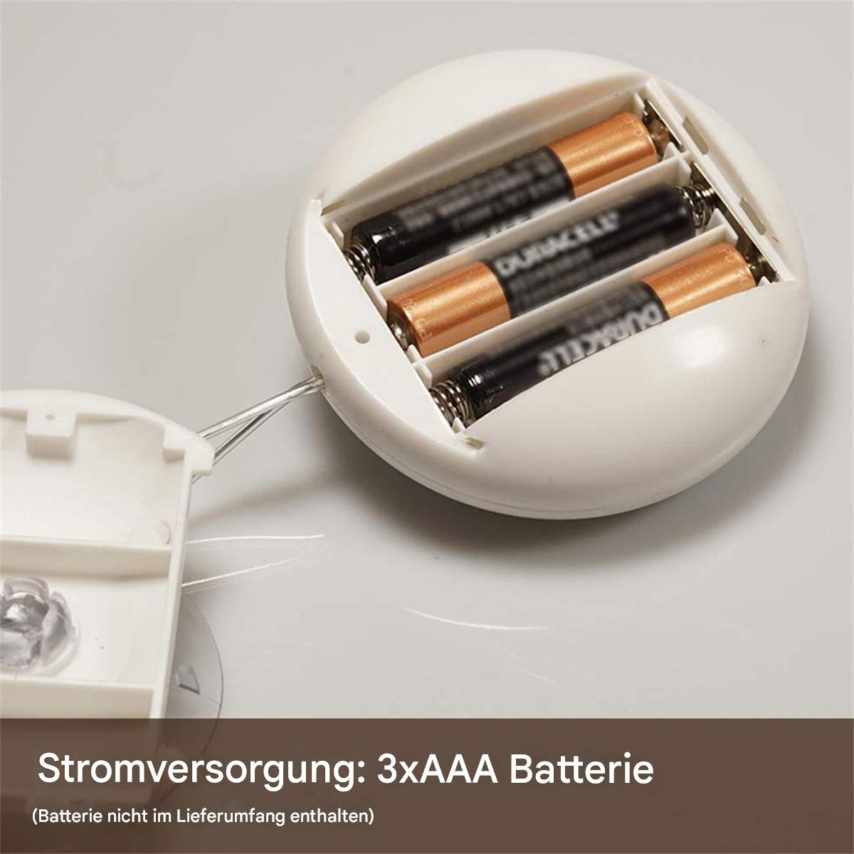 Weißes Batteriefach mit drei Duracell AAA-Batterien. Text: Stromversorgung.