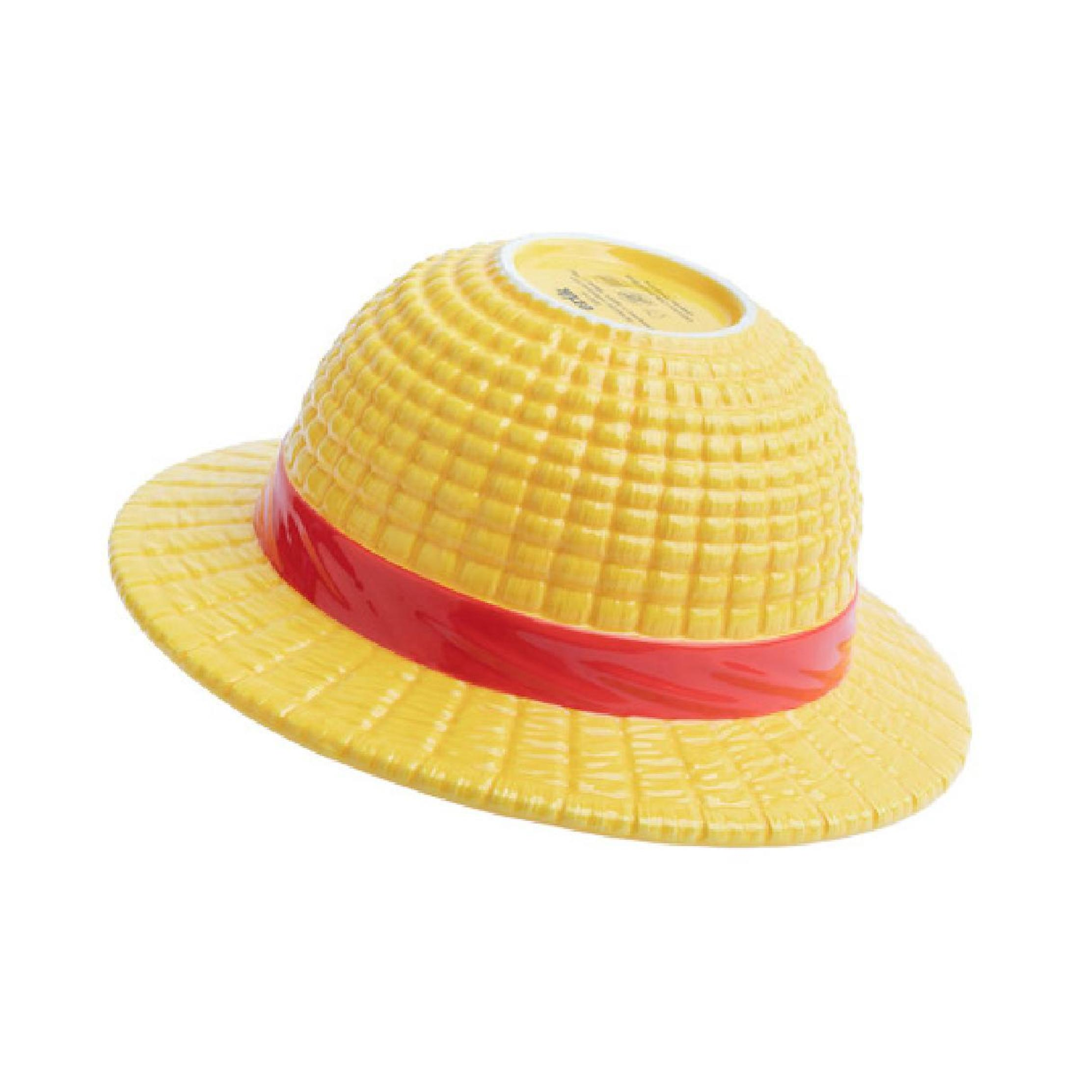 Cuenco amarillo con forma de sombrero con una banda roja, boca abajo. Fondo blanco.