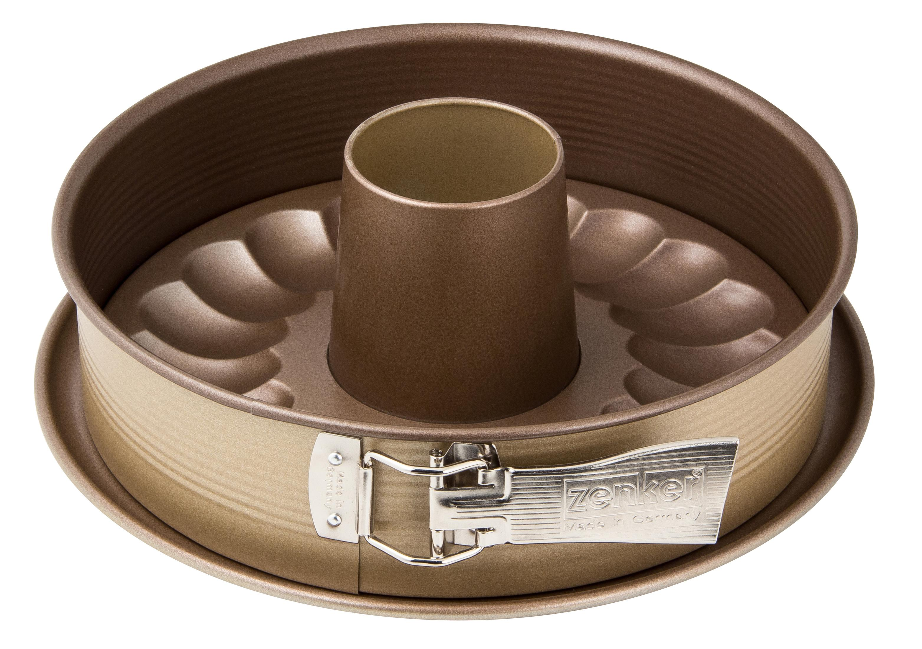 Eine goldene Gugelhupf-Form mit einem zentralen Rohr und einem Verriegelungsmechanismus.