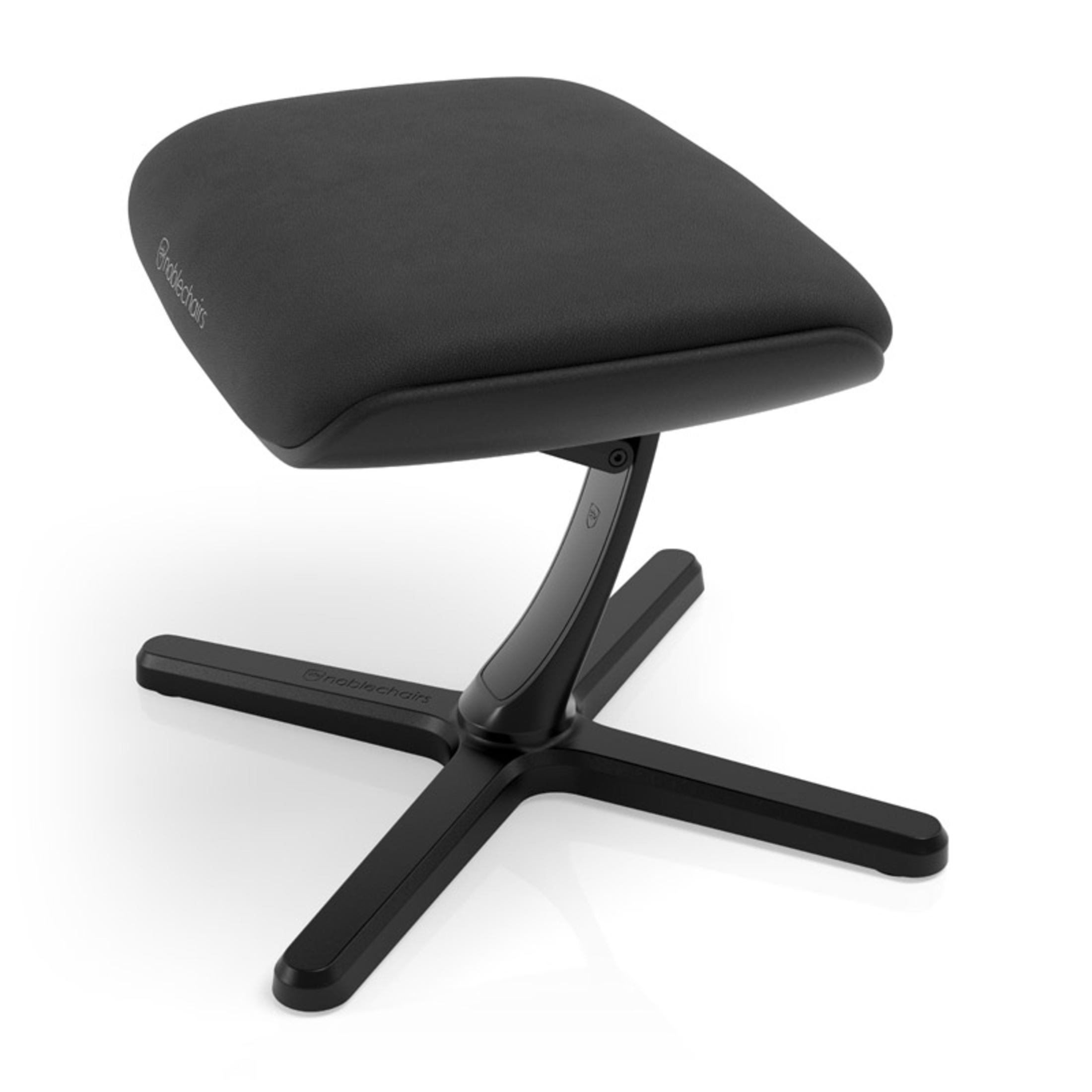 Schwarze ergonomische Fußstütze mit gepolsterter Oberseite und kreuzförmigem Fuß.