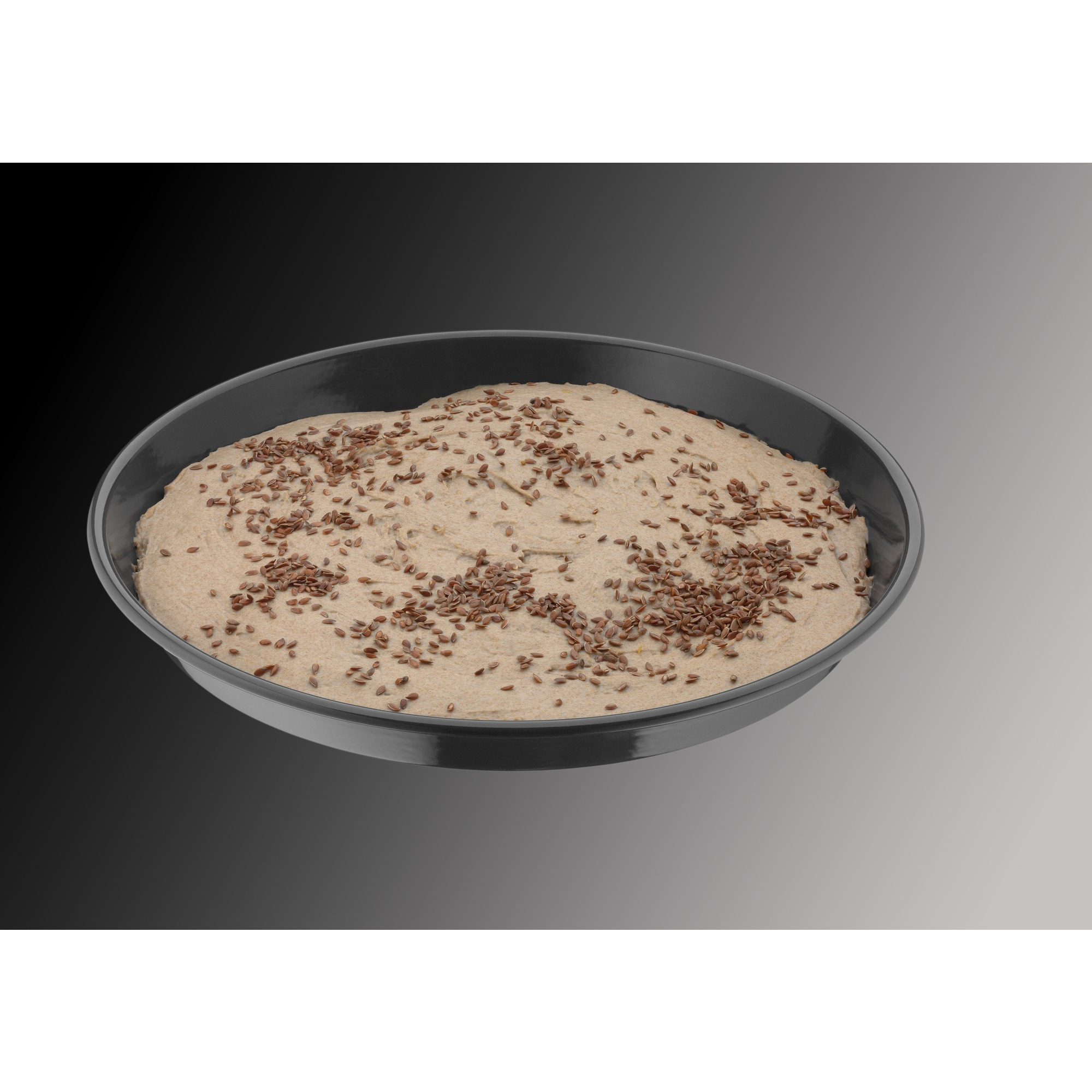 Okrągła forma do pieczenia z ciastem i nasionami, umieszczona na gradientowym tle.