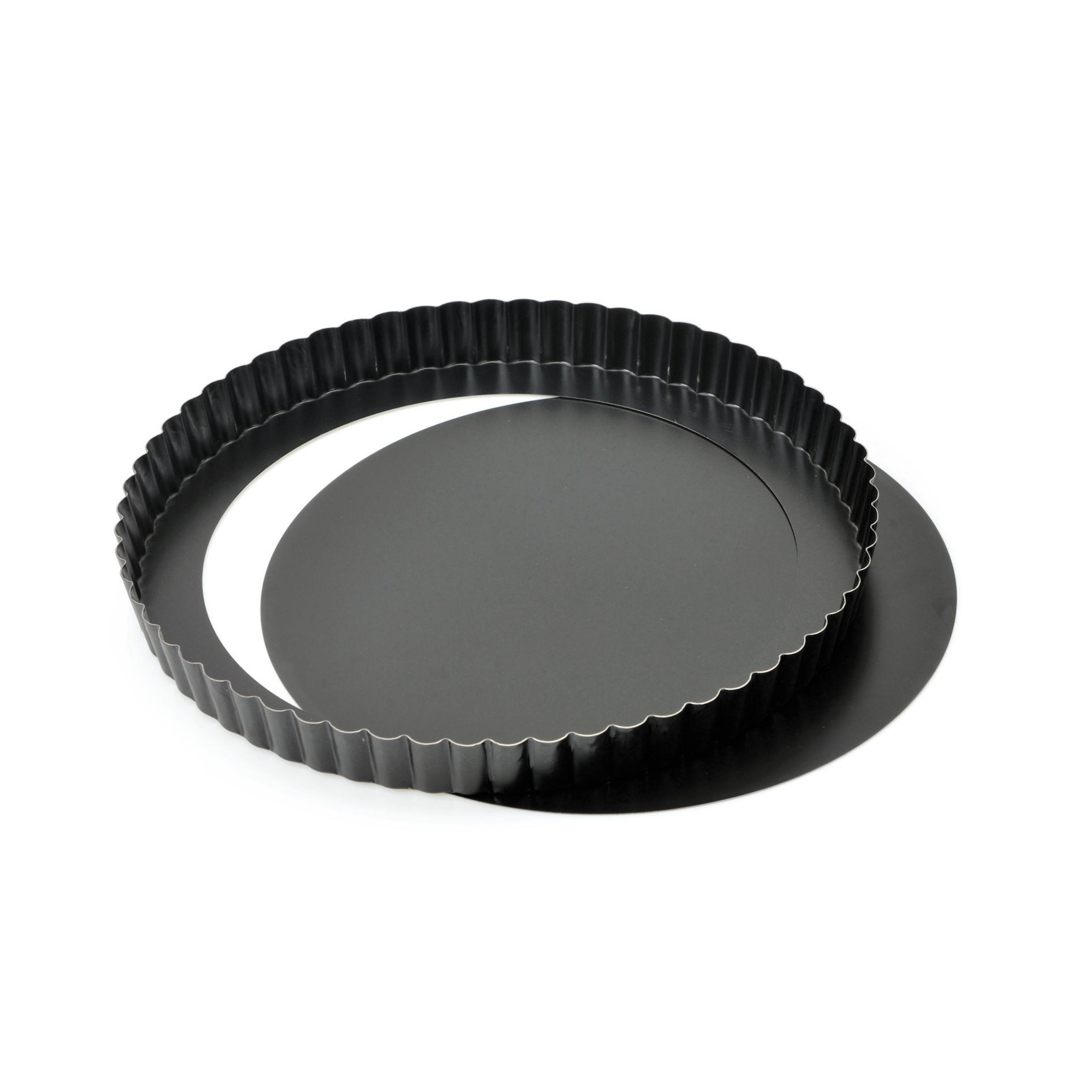 Schwarze runde Tarteform mit gewellten Seiten und herausnehmbarem Boden.