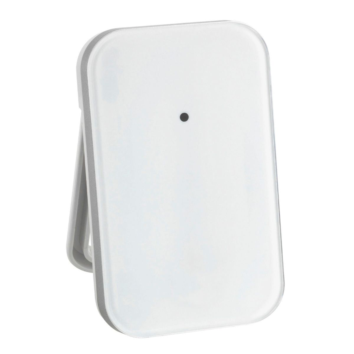 Appareil rectangulaire blanc avec point noir, soutenu par un support gris, isolé sur fond blanc.