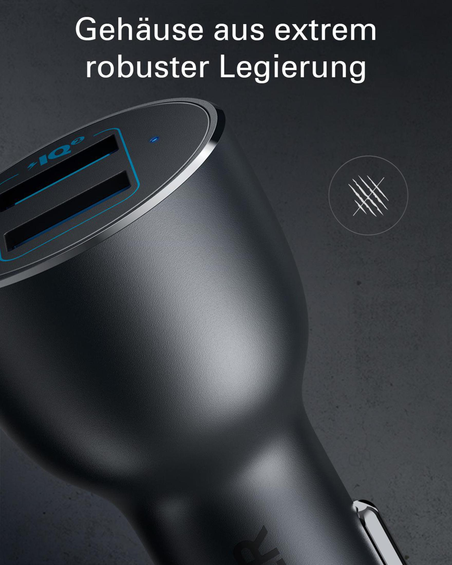 Primo piano di caricatore per auto nero con due porte USB. Testo tedesco in alto.