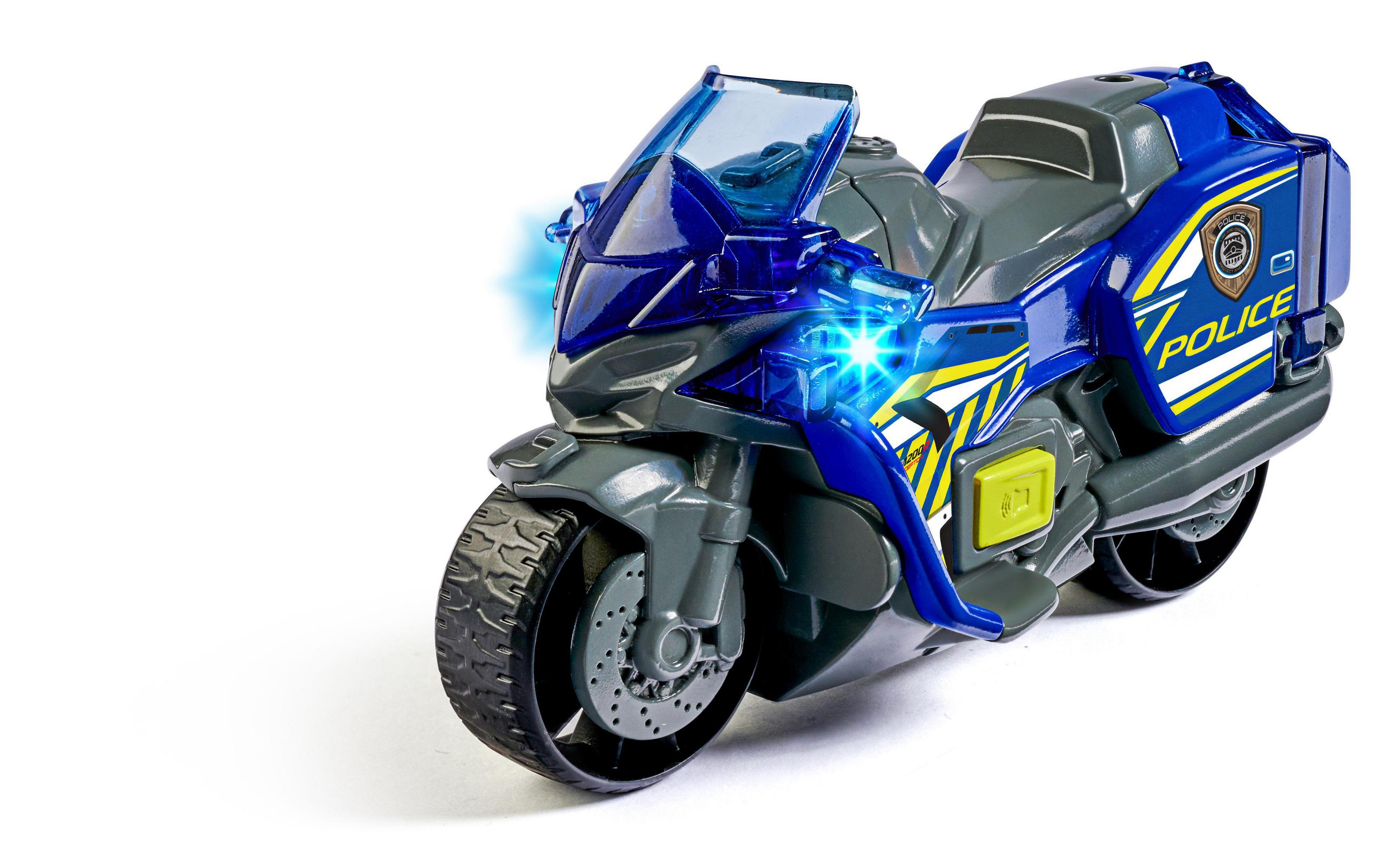Spielzeug-Polizeimotorrad mit eingeschalteten Lichtern auf weißem Hintergrund.