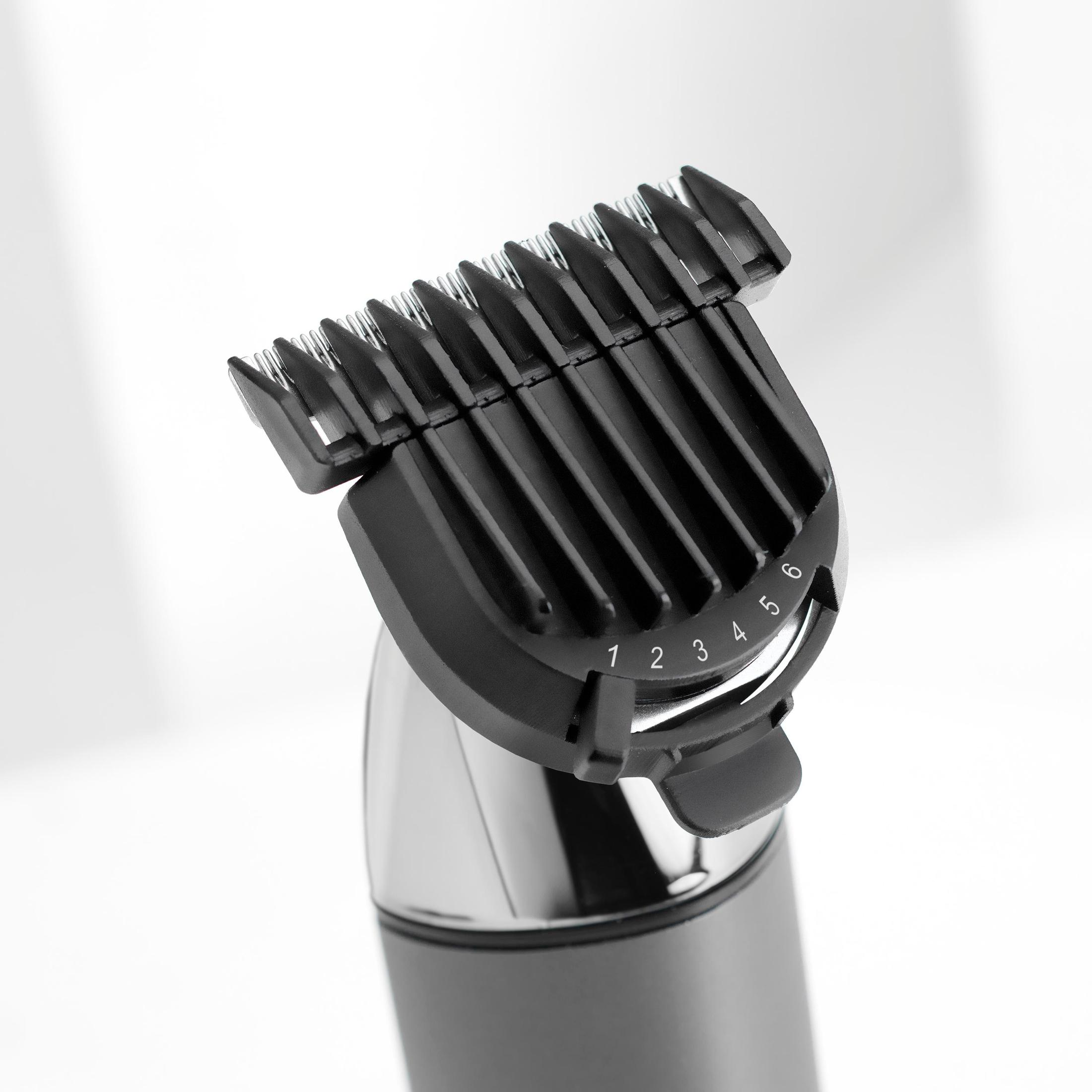 Recortadora de cabello negra con un peine guía numerado, que muestra los ajustes de longitud de corte.