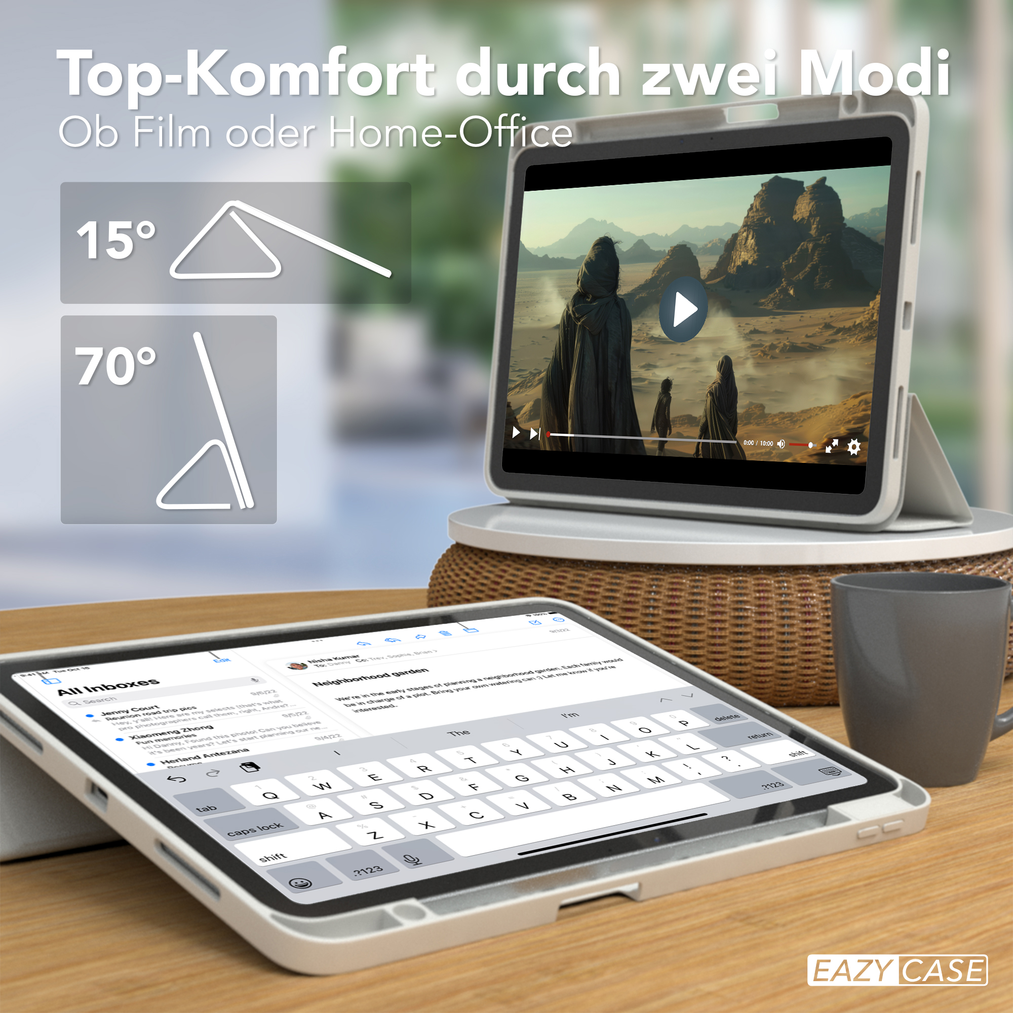 Zwei Tablets, eines mit Video, das andere mit Tastatur, auf einem Holztisch.