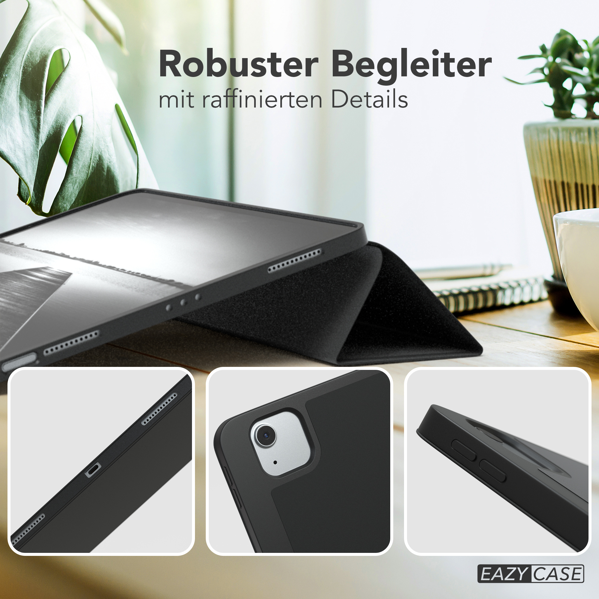 Schwarze Tablethülle auf einem Holztisch mit grünen Blättern. Details der Hülle sind im Nahaufnahme gezeigt.