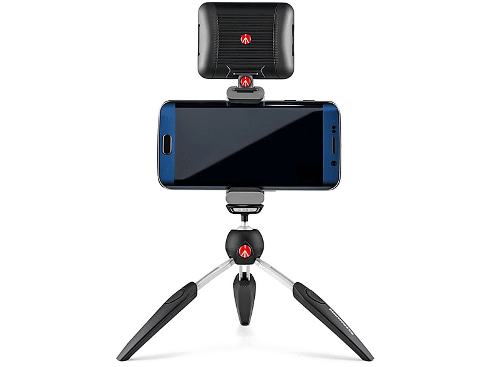 Smartfon na statywie z lampą u góry, czarne tło.