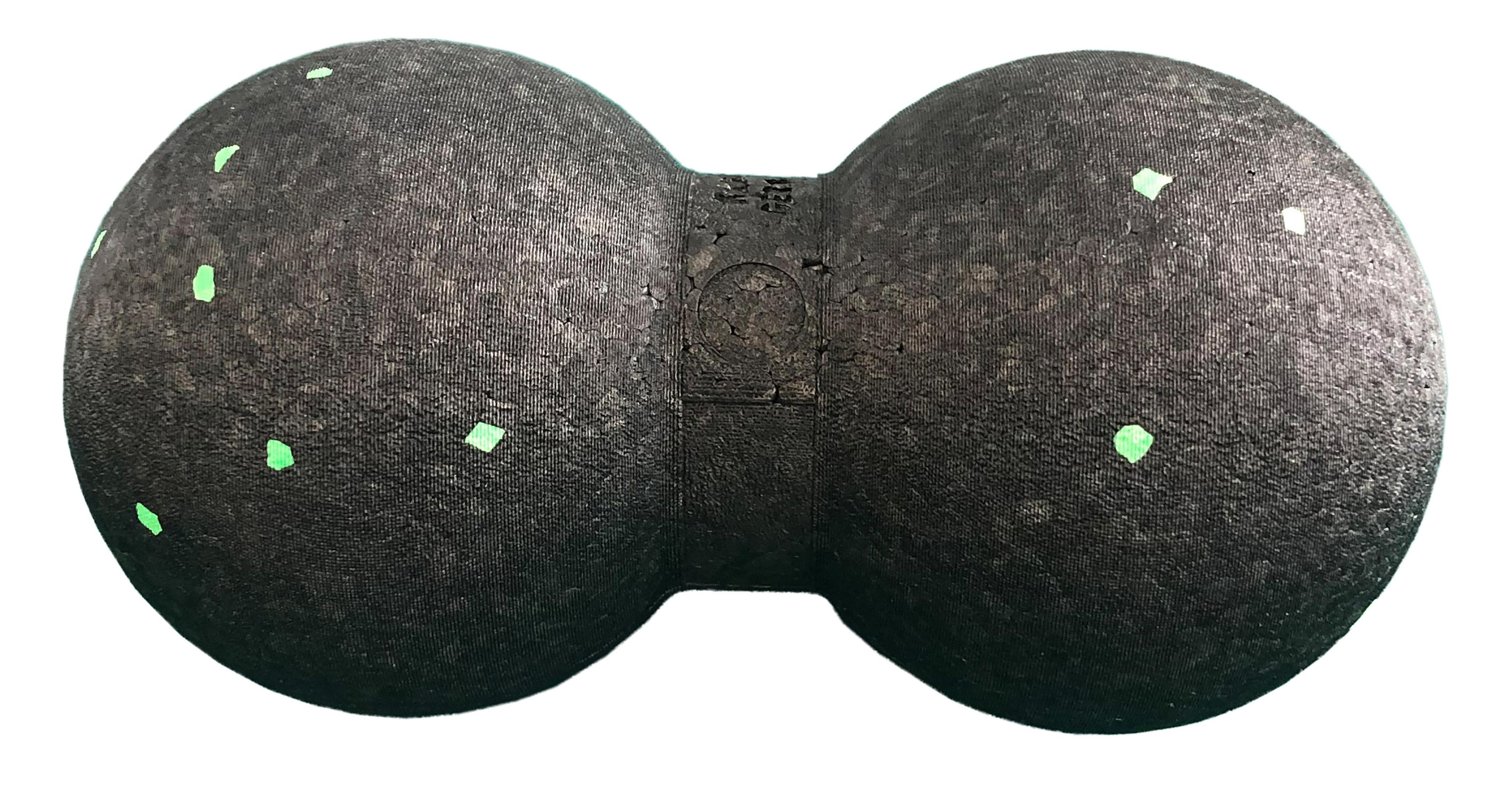 Ein schwarzer Massageball mit Doppelball-Design und grünen Punkten darauf.