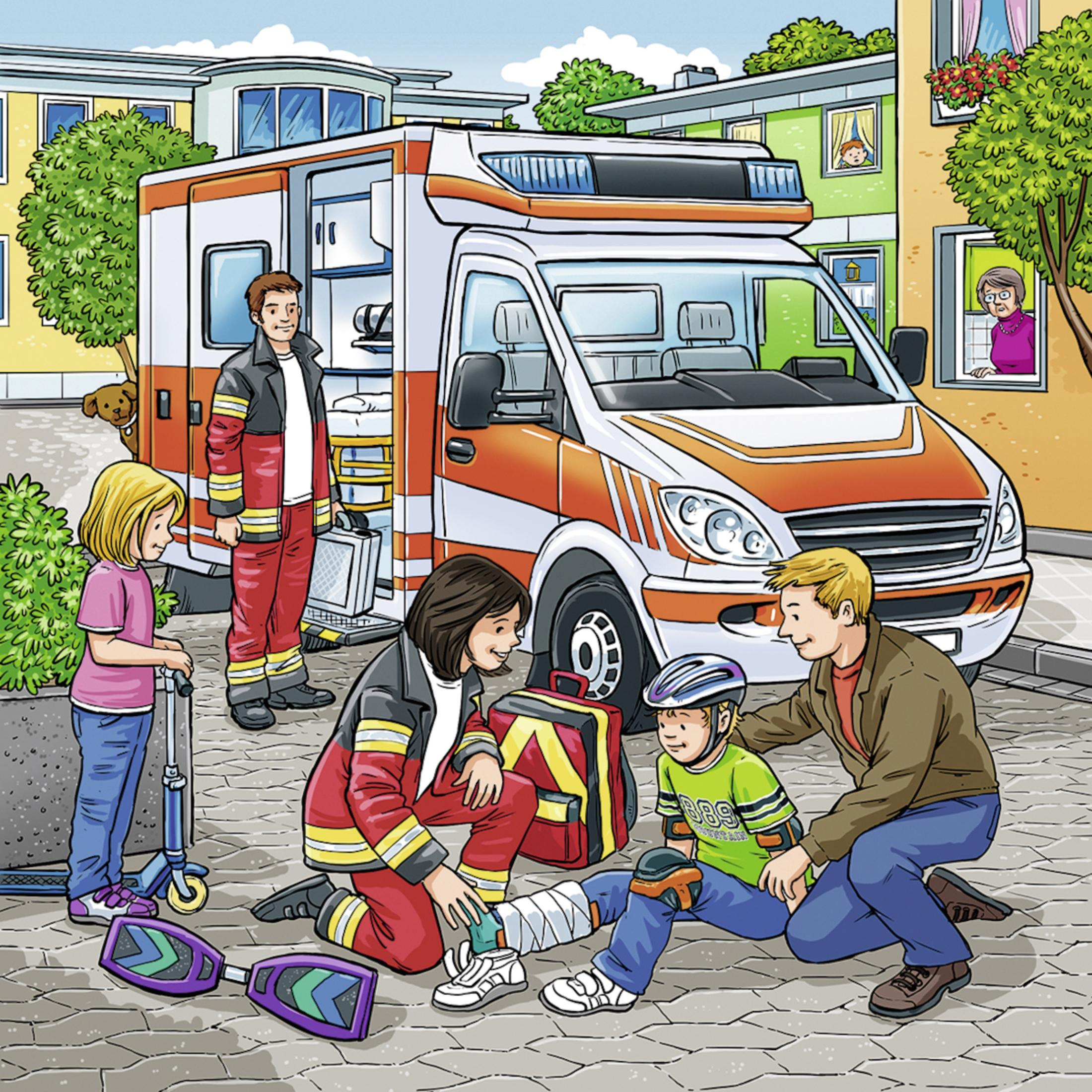 Ambulans z ratownikami. Chłopiec jest ranny na ziemi.