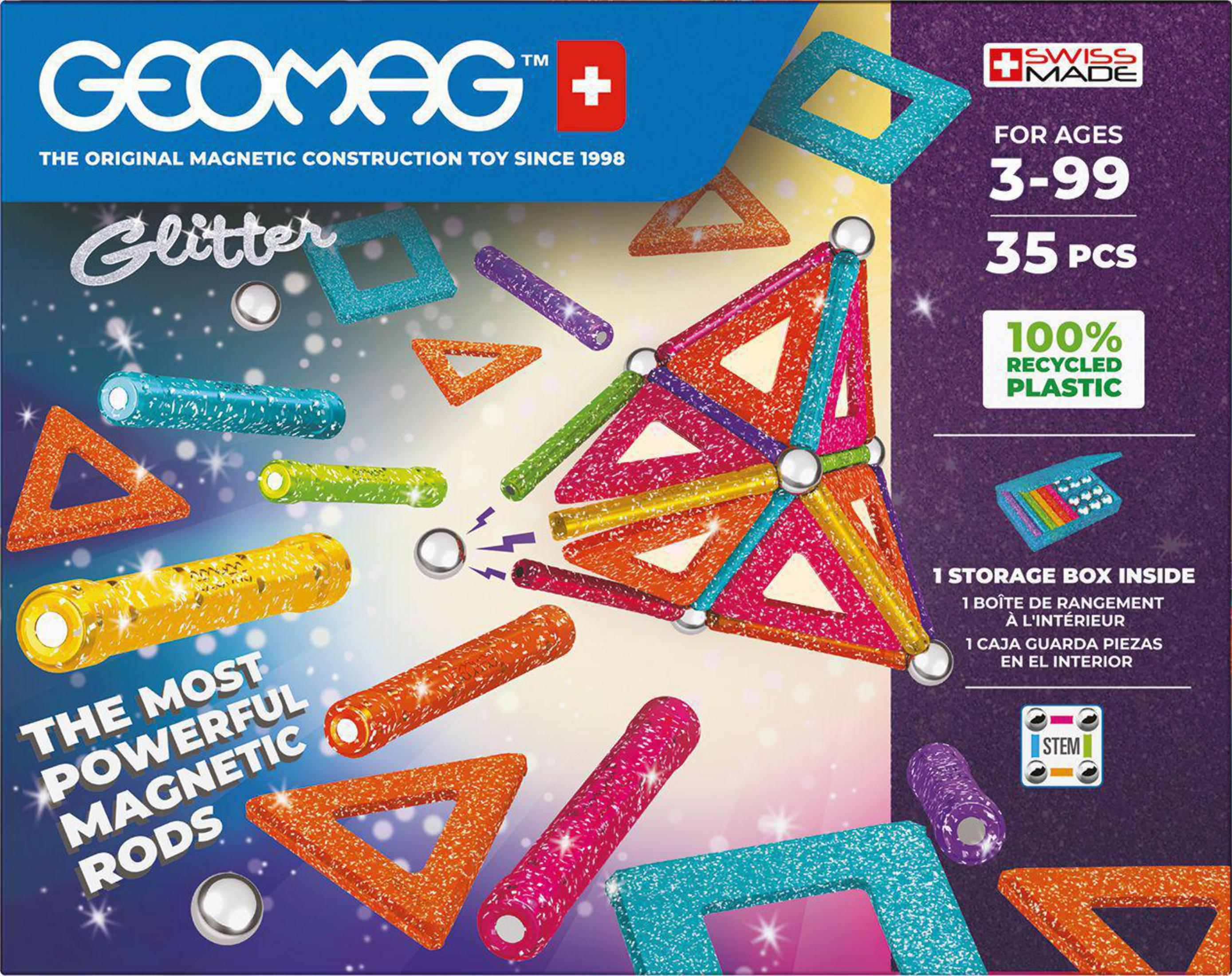 Una caja de juguetes Geomag con barras magnéticas coloridas, triángulos y elementos brillantes.