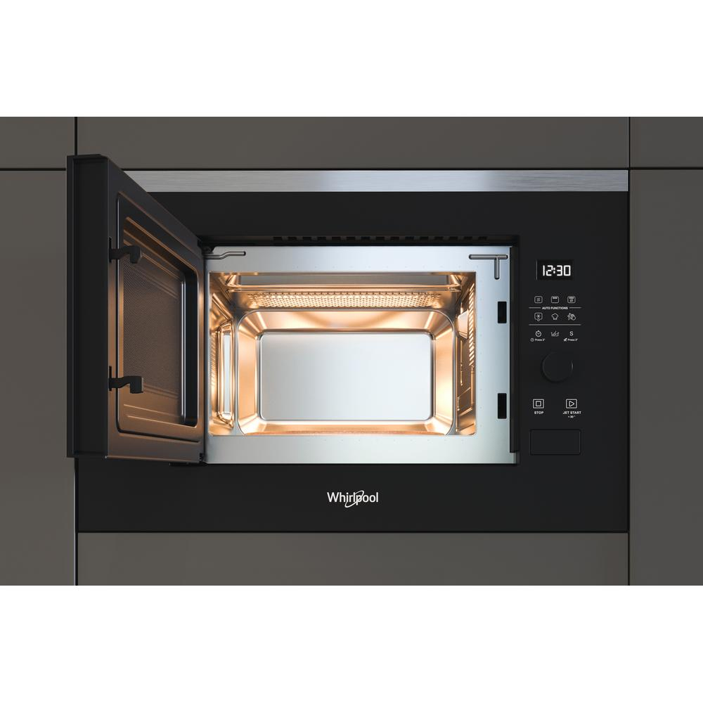 Microwave oven with open door, showing interior. The frame is black, the background is gray.