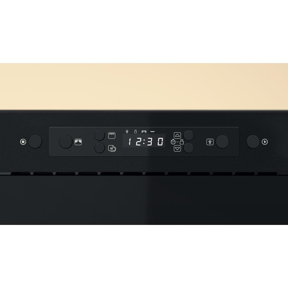 Czarny panel sterowania wbudowanego urządzenia z wyświetlaczem cyfrowym pokazującym godzinę i różne przyciski.