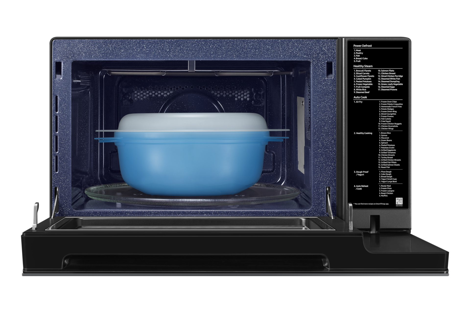 Microwave oven with a blue container inside, glass plate, and control panel on the right.