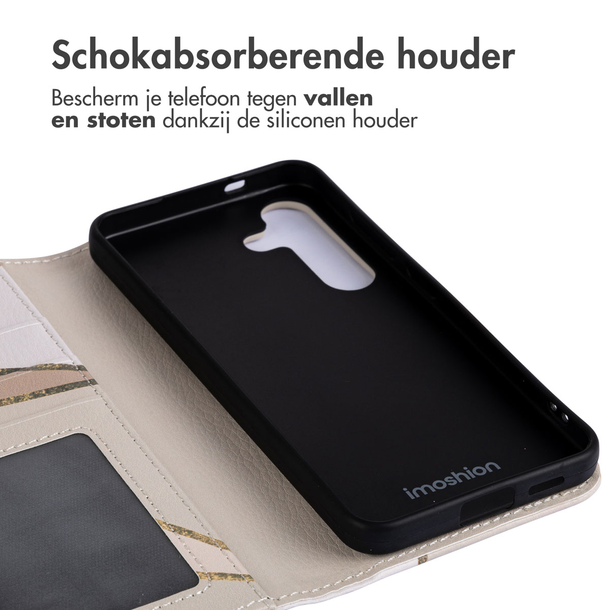 Telefoonhoes binnenkant, zwarte telefoonhouder en een crèmekleurig gedeelte met een geometrisch patroon.