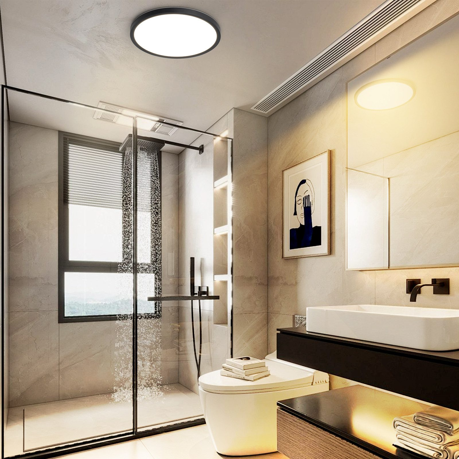 Interni bagno con doccia, wc, lavandino e un quadro appeso alla parete.