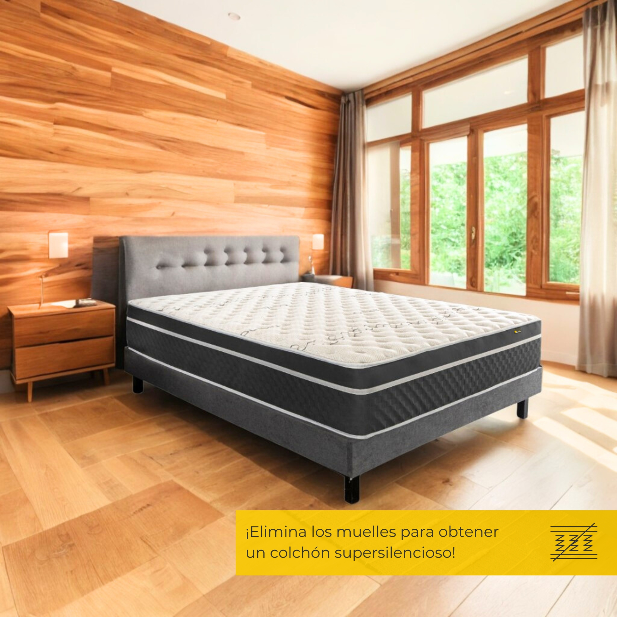 Cama con cabecero gris, colchón blanco y gris, y suelo de madera.
