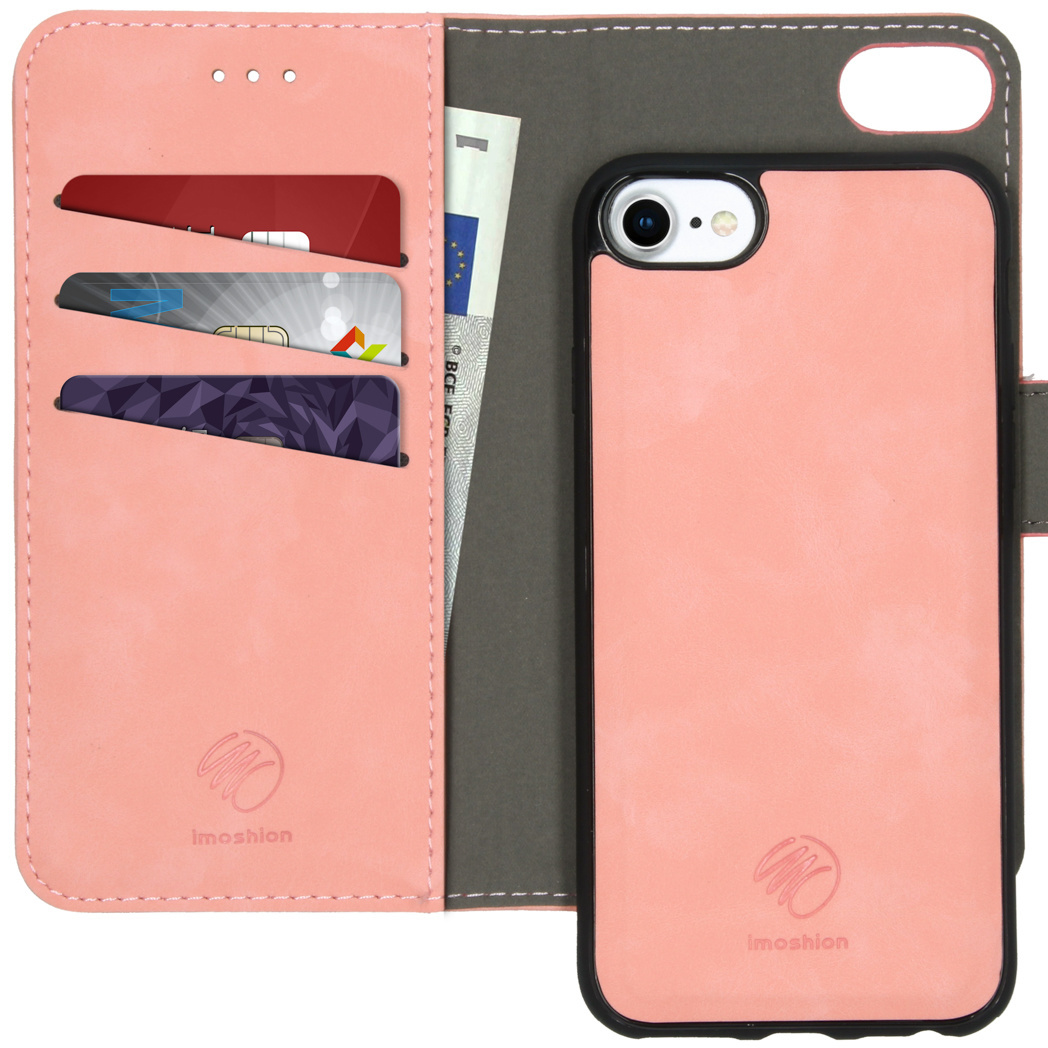 Een roze telefoonhoesje met een portemonnee-ontwerp, met kaartsleuven en een geldenvak, met een open zicht.