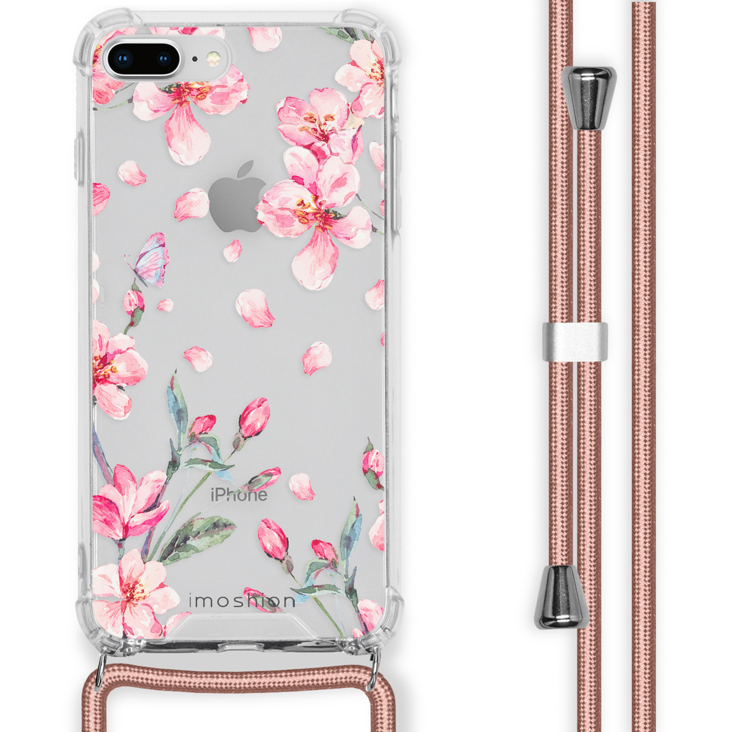 Une coque de téléphone avec un motif floral rose et une lanière de téléphone rose assortie.