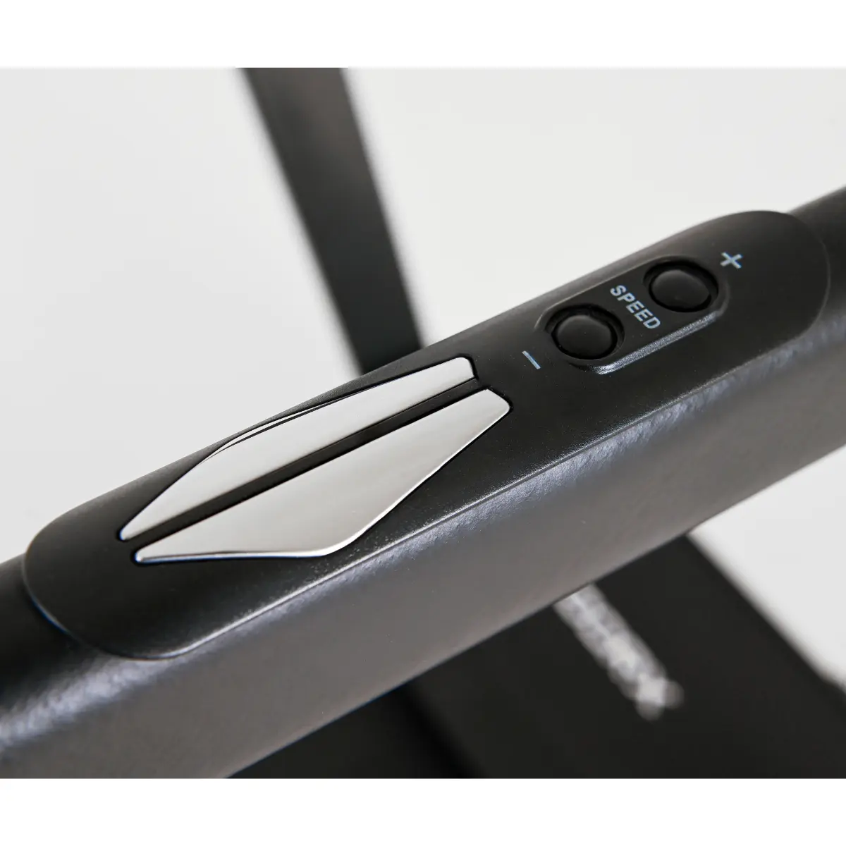 Black treadmill control panel with speed buttons and arrow keys.