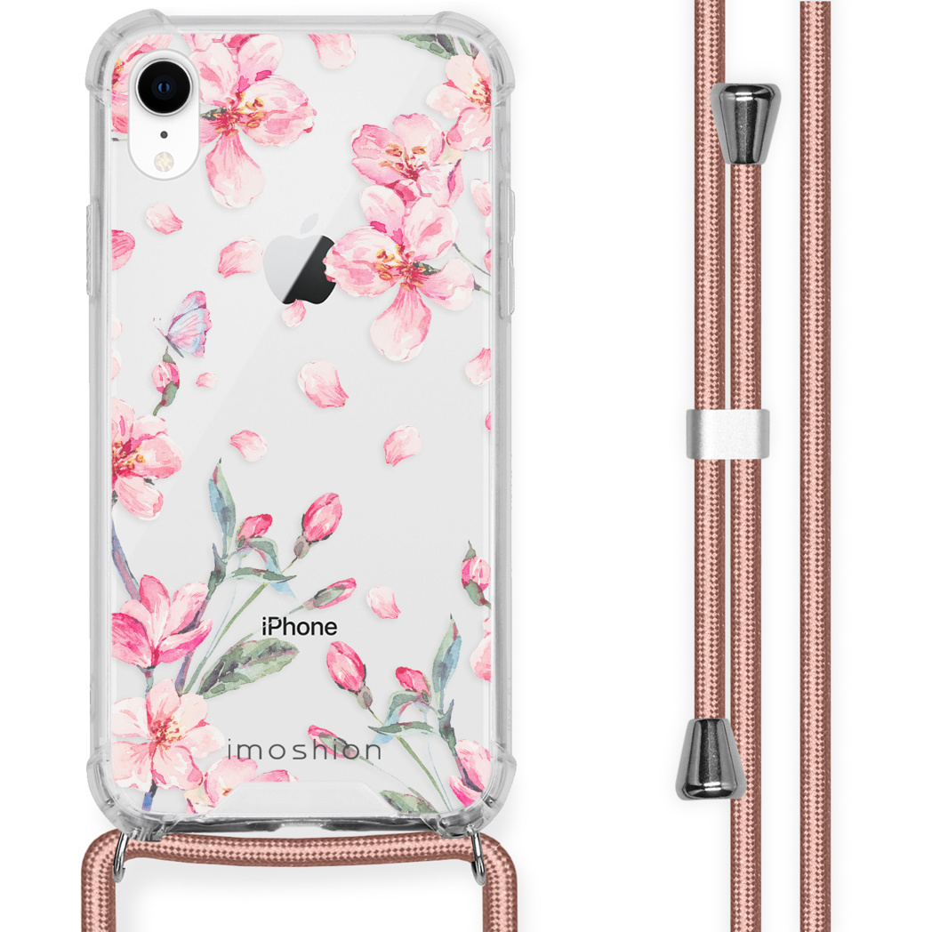 iPhone met bloemenhoes en koord. De hoes heeft roze bloemen en bladeren. Het koord is roze.