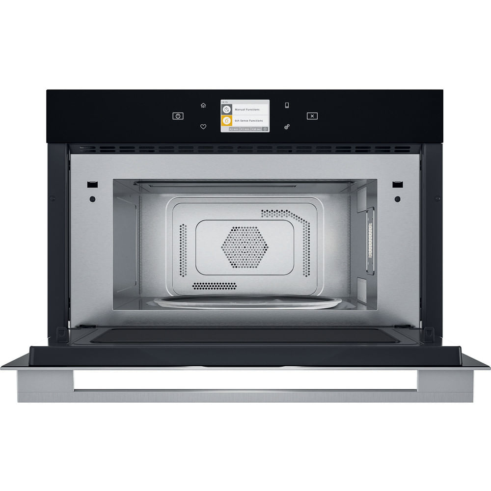 Binnenaanzicht van een zwarte magnetron. De deur is open.