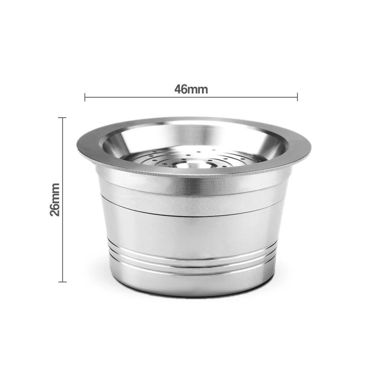 A silver coffee capsule. The capsule is cylindrical and has a perforated base.