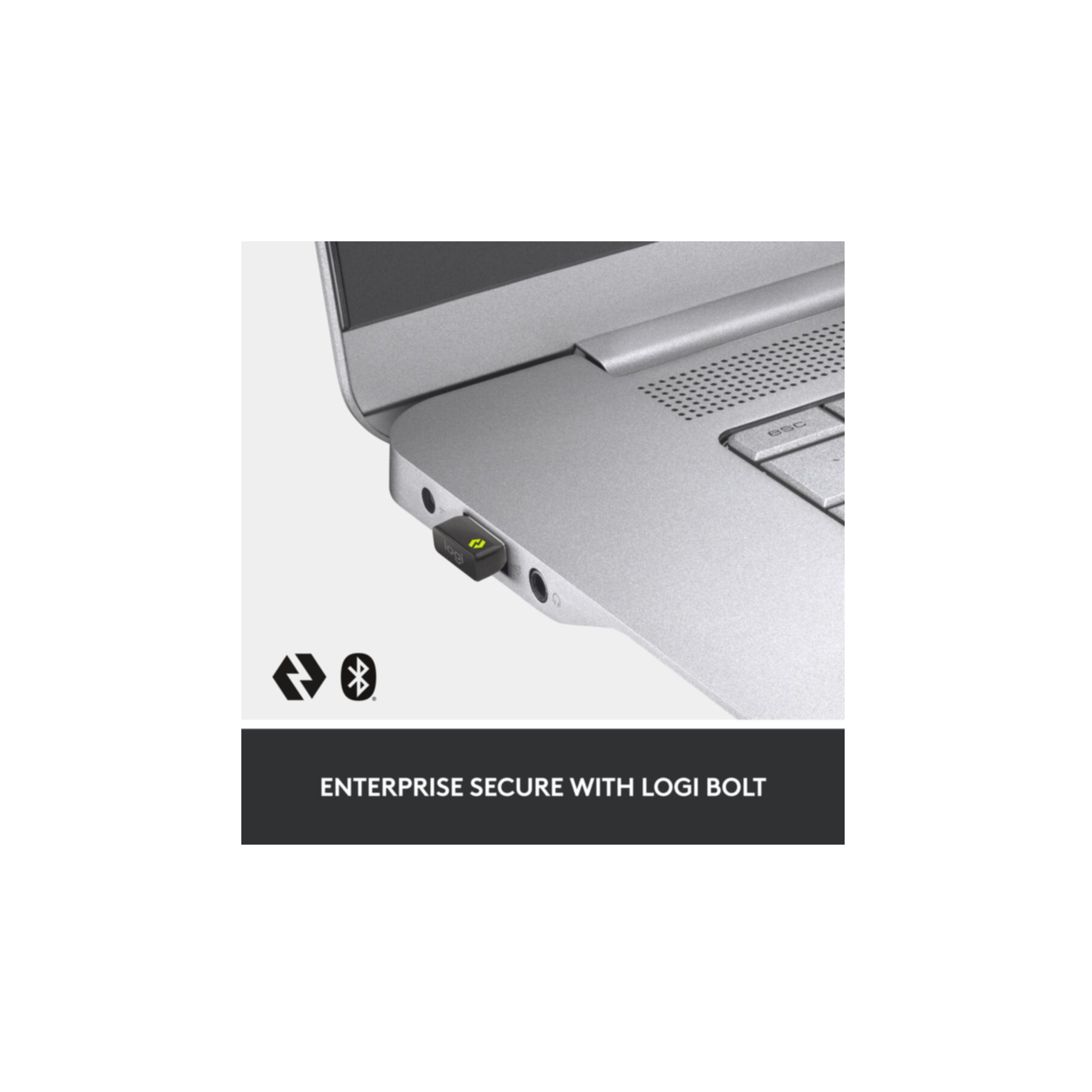 Czarny dongle USB podłączony do srebrnego laptopa. Tekst: "Enterprise Secure with Logi Bolt".