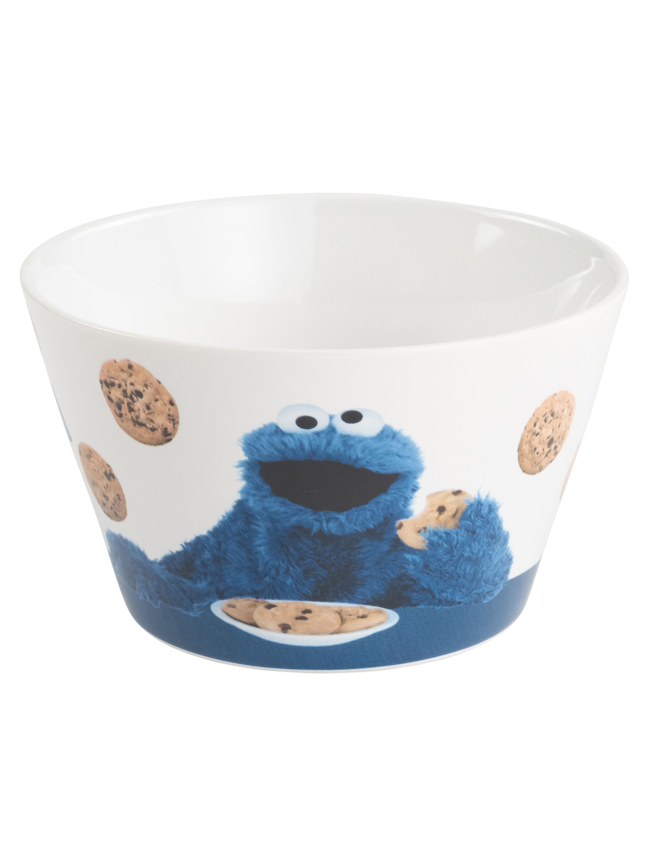 Eine weiße Schüssel mit Cookie Monster, Keksen, die herumfliegen, und Keksen auf einem Teller.