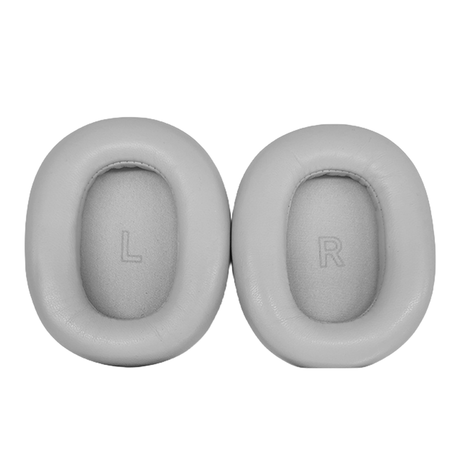 Dwie szare nauszniki z oznaczeniami 'L' i 'R', do słuchawek. Białe tło.
