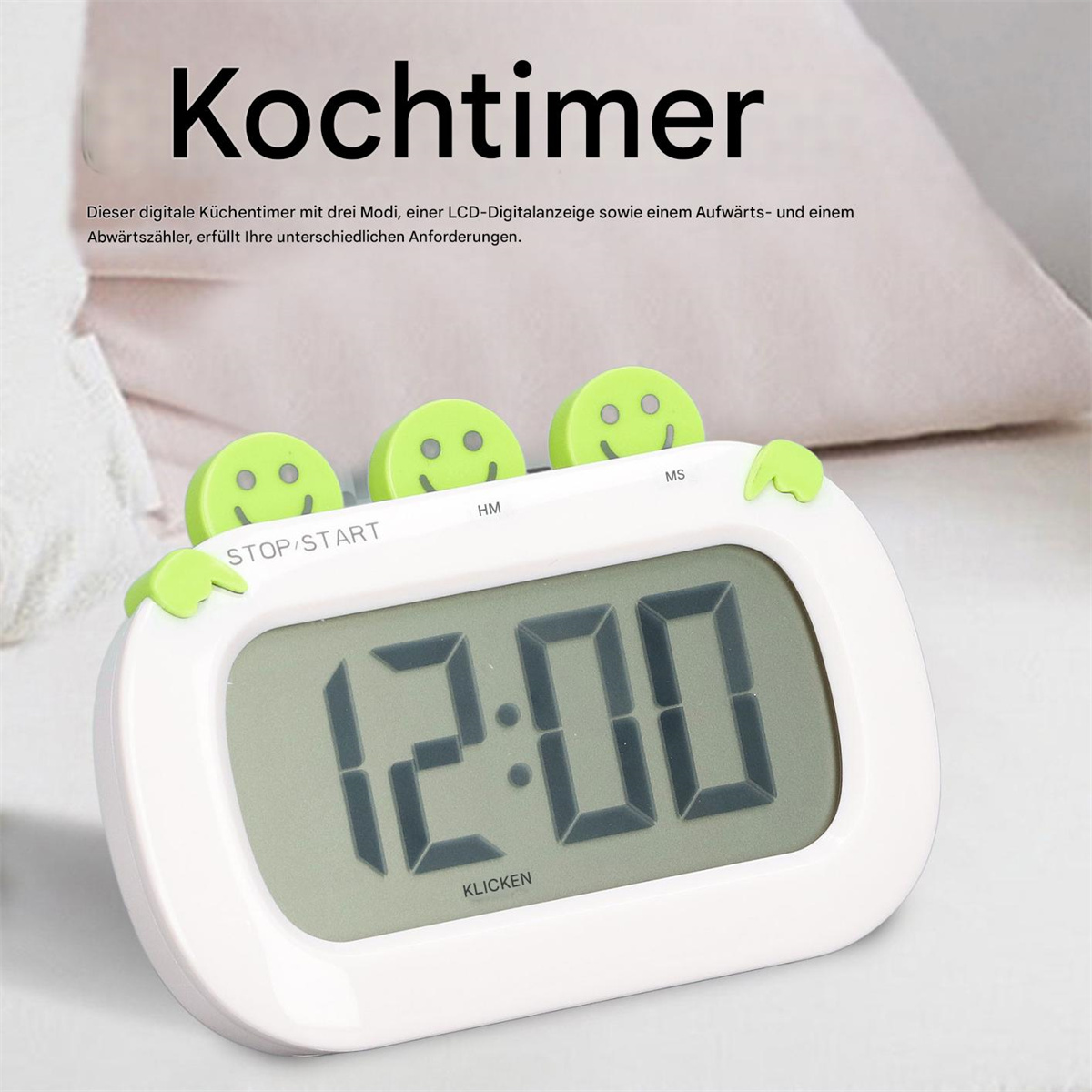 Ein digitaler Küchentimer mit Anzeige 12:00 und Smiley-Gesicht-Tasten.