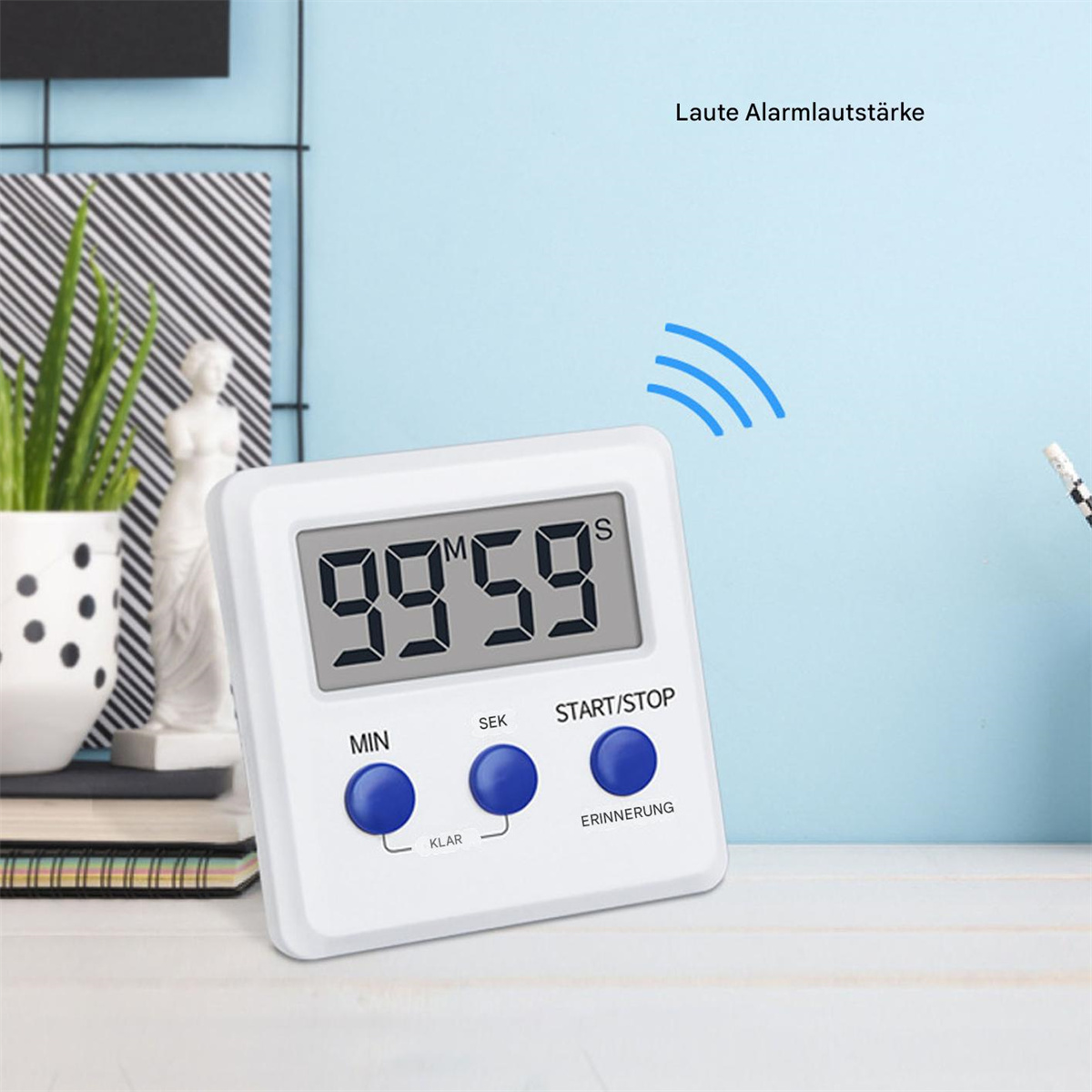 Ein weißer Timer mit blauen Knöpfen und digitaler Zeitanzeige.