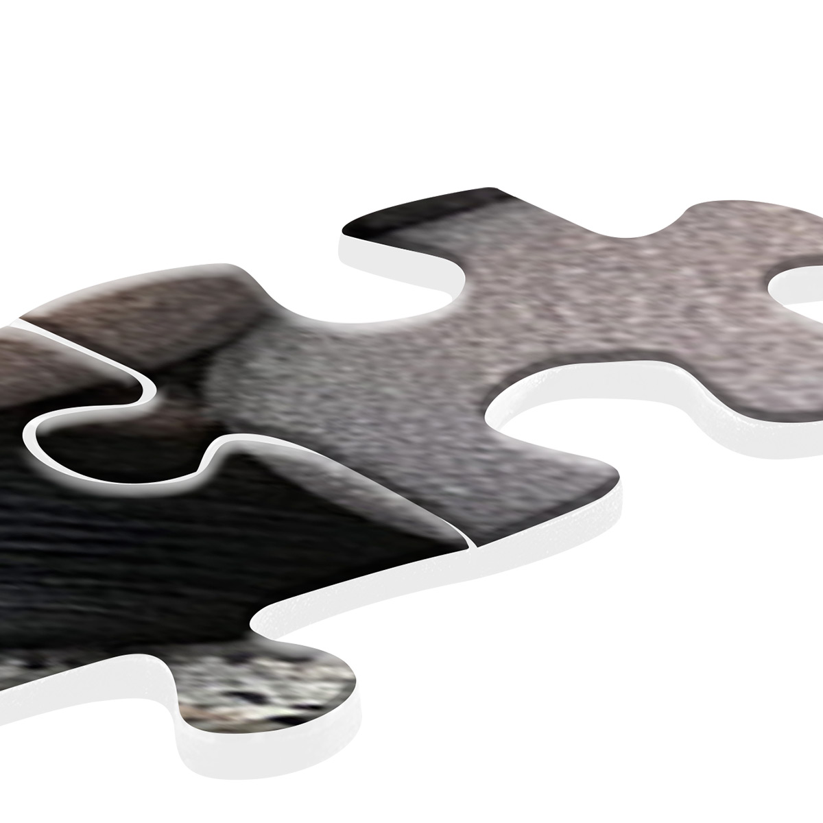 Due pezzi di puzzle, uno con una texture di pietra, l'altro con una texture di pietra grigia. Sfondo bianco.