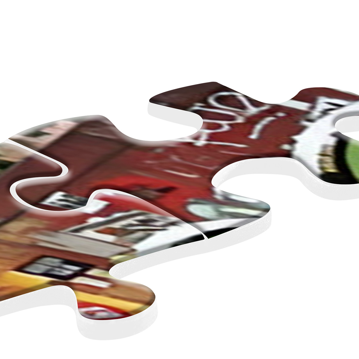 Pezzo di puzzle con una sezione di un edificio con graffiti. Bordi bianchi e sfondo bianco.