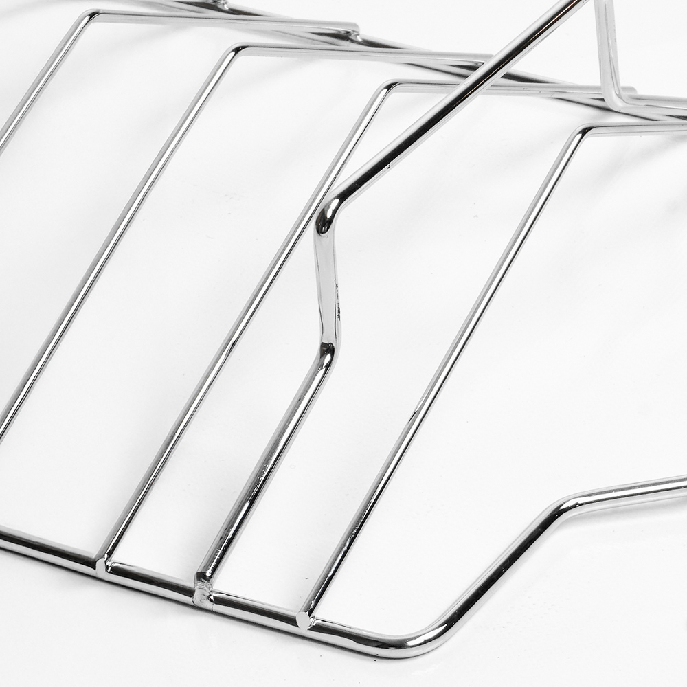 Chrome metal rack. Slender, parallel bars forming a rectangular shape. Shiny surface.
