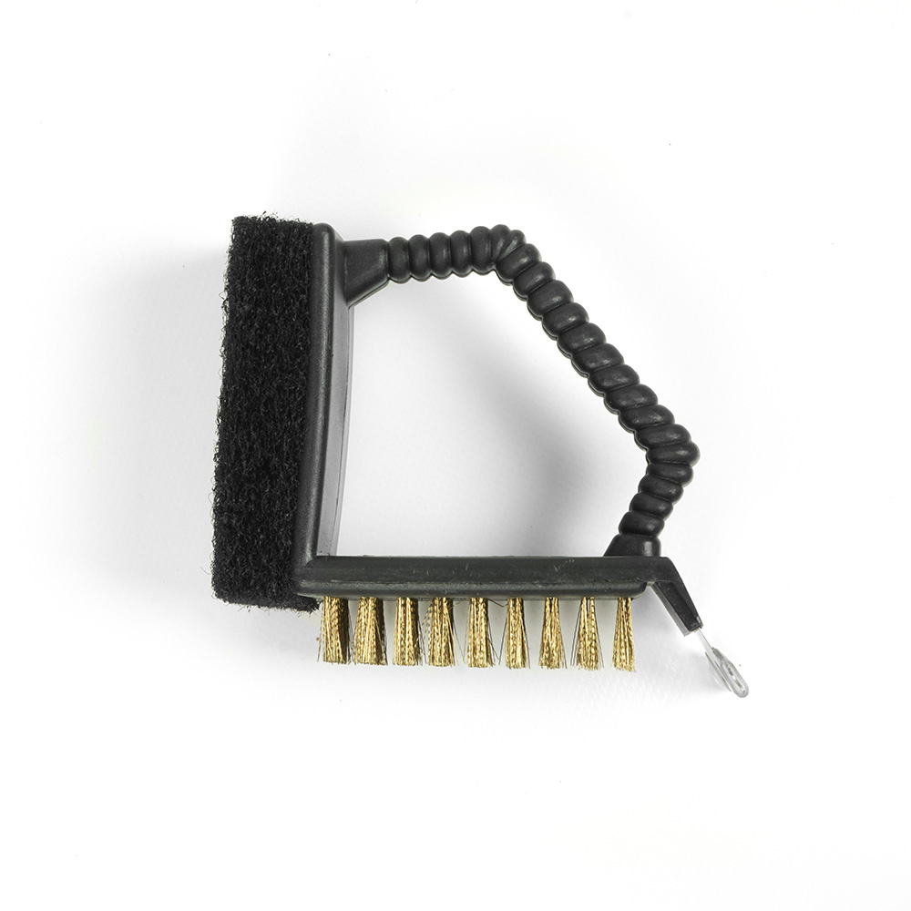 A black grill cleaning brush with a handle and brass bristles on white background.