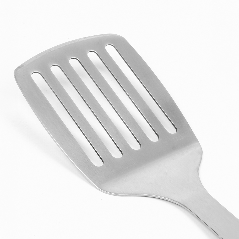 A stainless steel spatula with five rectangular slots and a handle, against a white background.