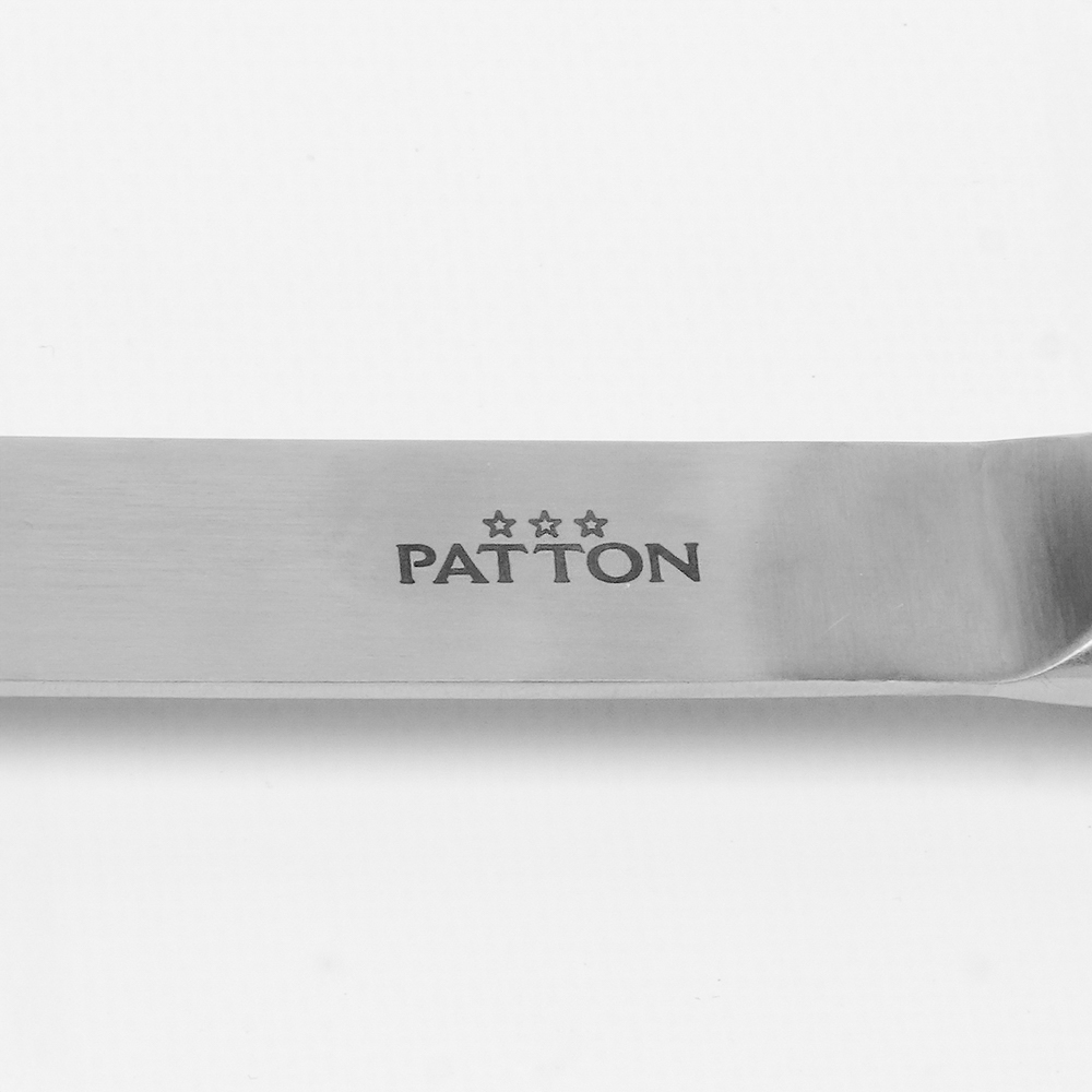 Close up of a silver knife with the word PATTON and three stars.