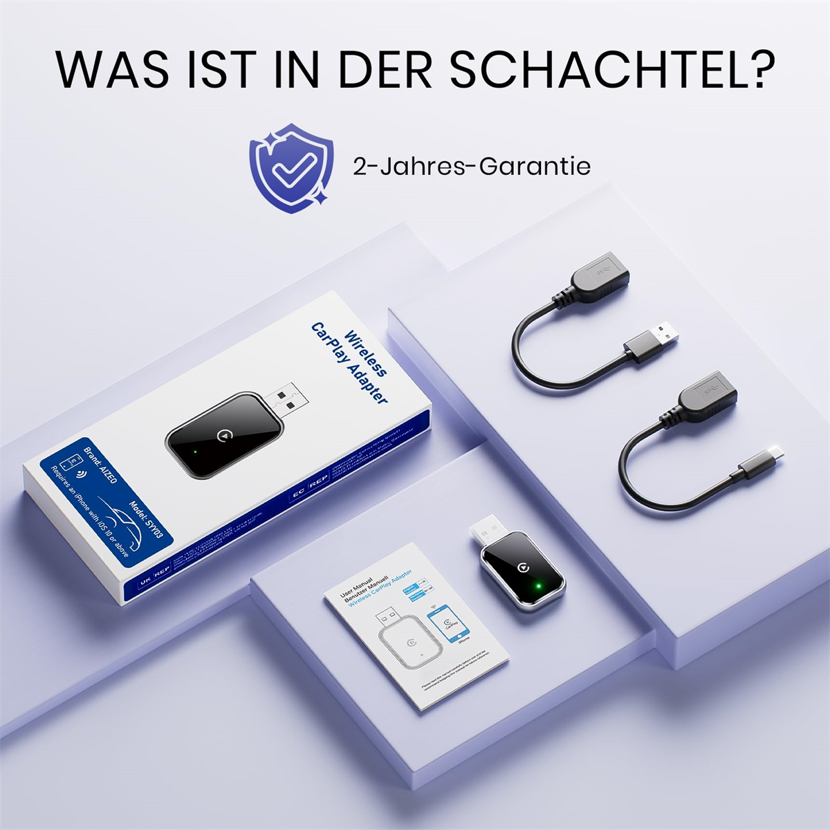 Box und Zubehör eines kabellosen CarPlay-Adapters; kleine schwarze Adapter und Kabel.