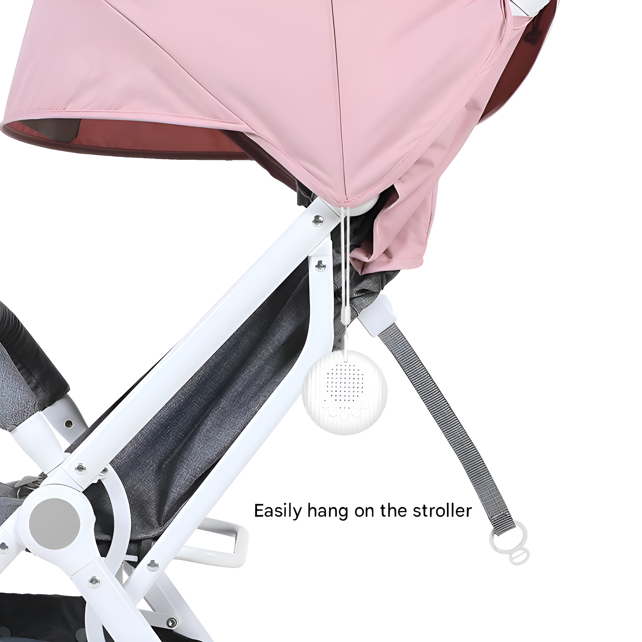 Ein rosa Kinderwagenverdeck mit weißem Rahmen und ein weißes rundes Objekt.