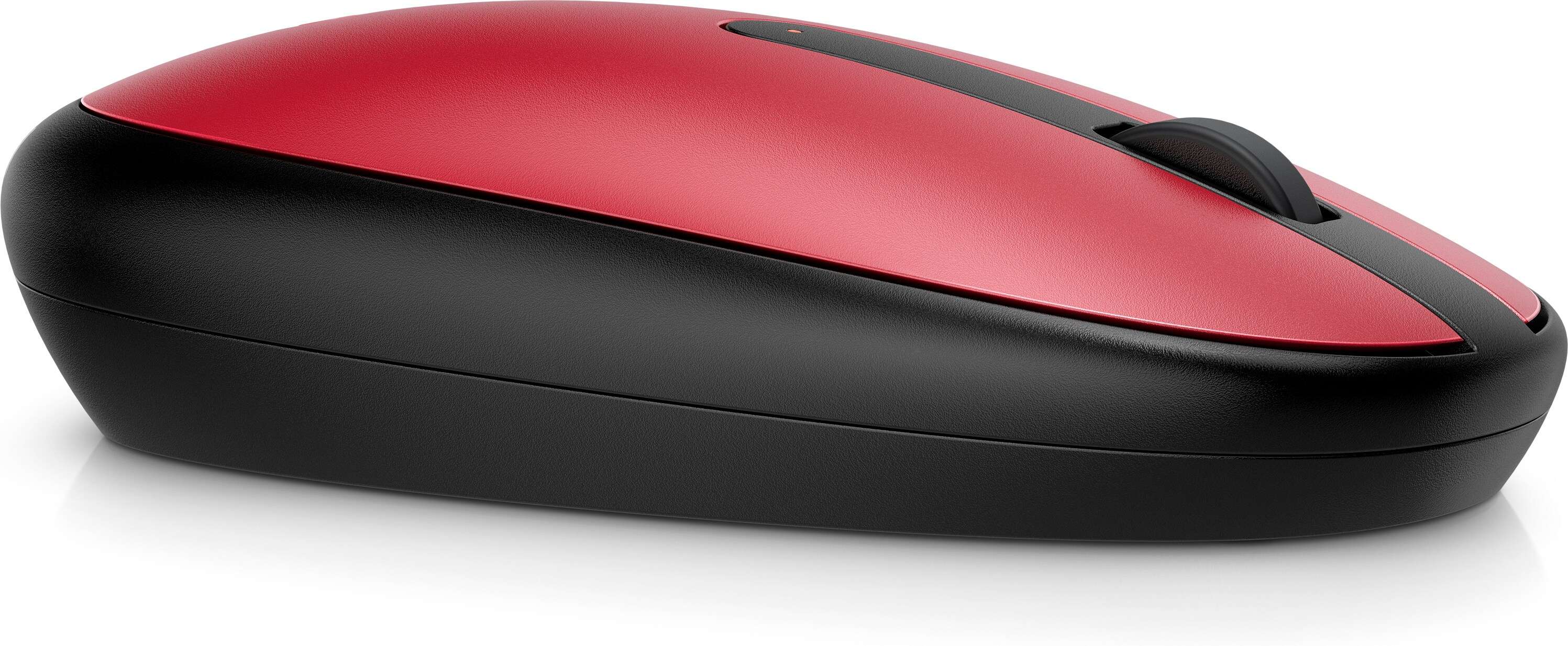 Souris sans fil rouge et noire avec molette de défilement sur une surface blanche.