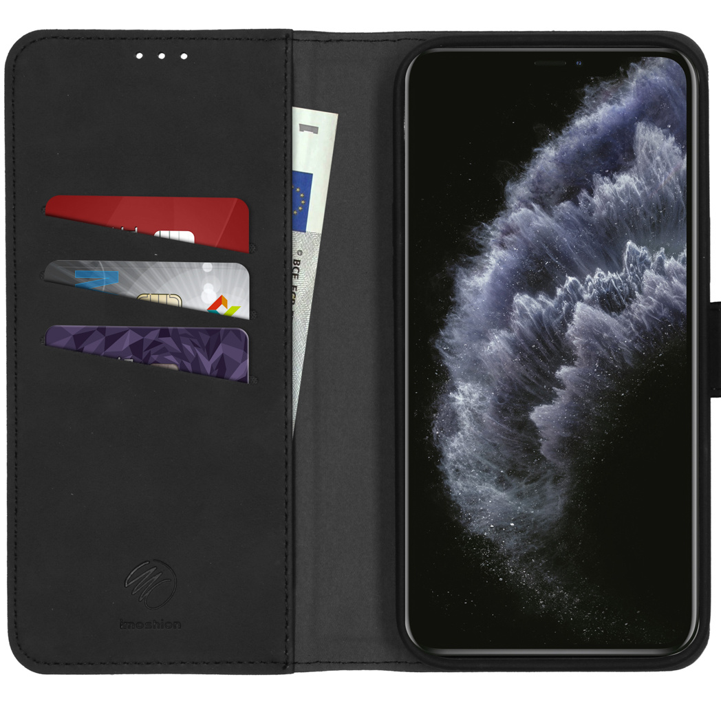 Étui de téléphone ouvert, montrant téléphone, cartes de crédit et argent. Cuir noir.